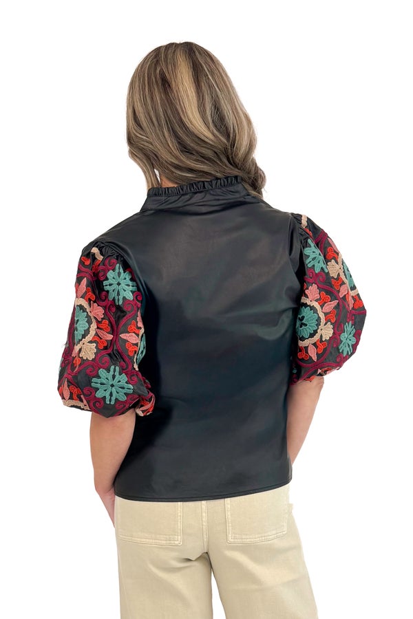 New Dawn black faux leather top with embroidered sleeves - back view on model