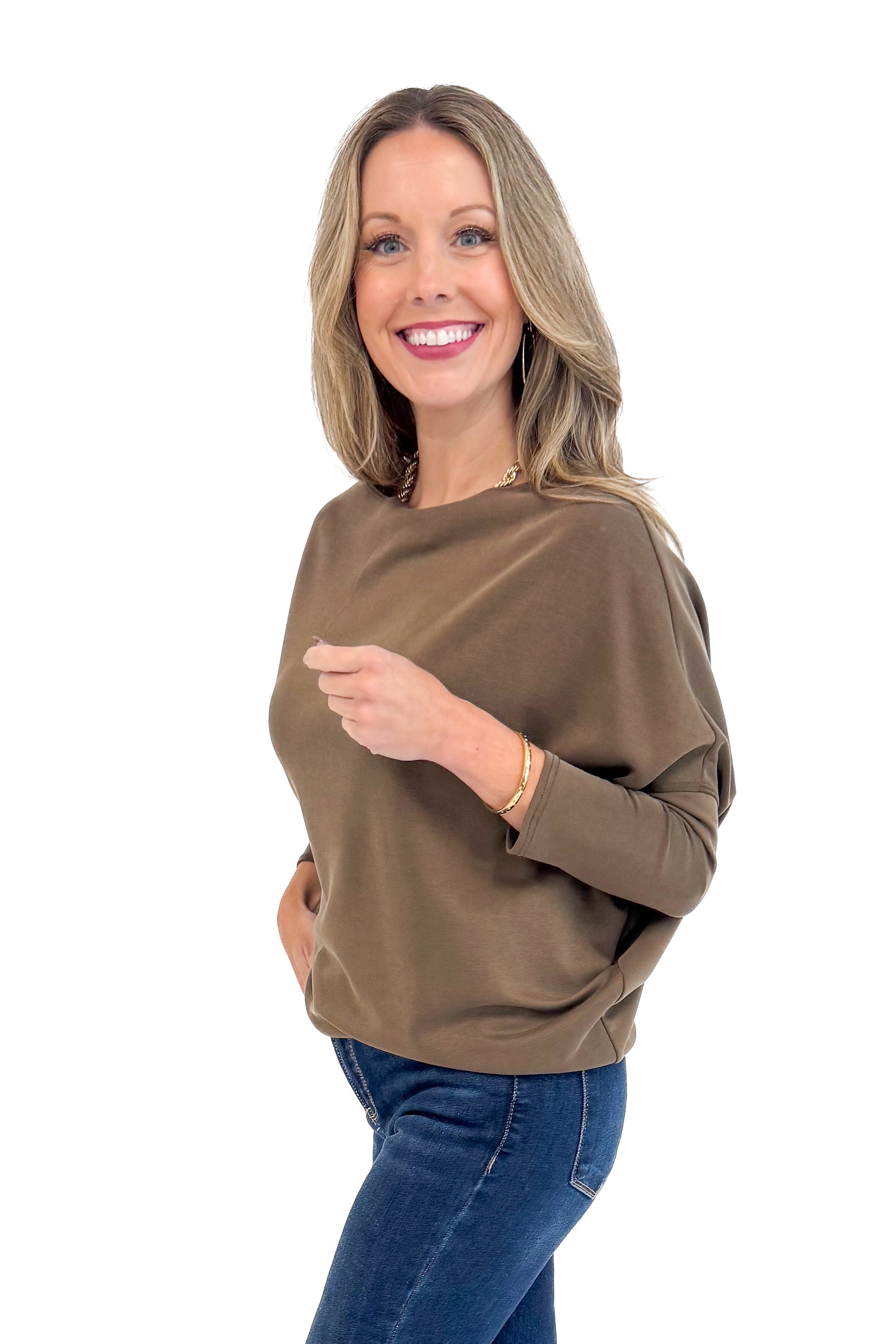 Woman wearing For Keeps Brown Boatneck Dolman Sleeve Top - side view showing elegant boatneck and relaxed dolman sleeves