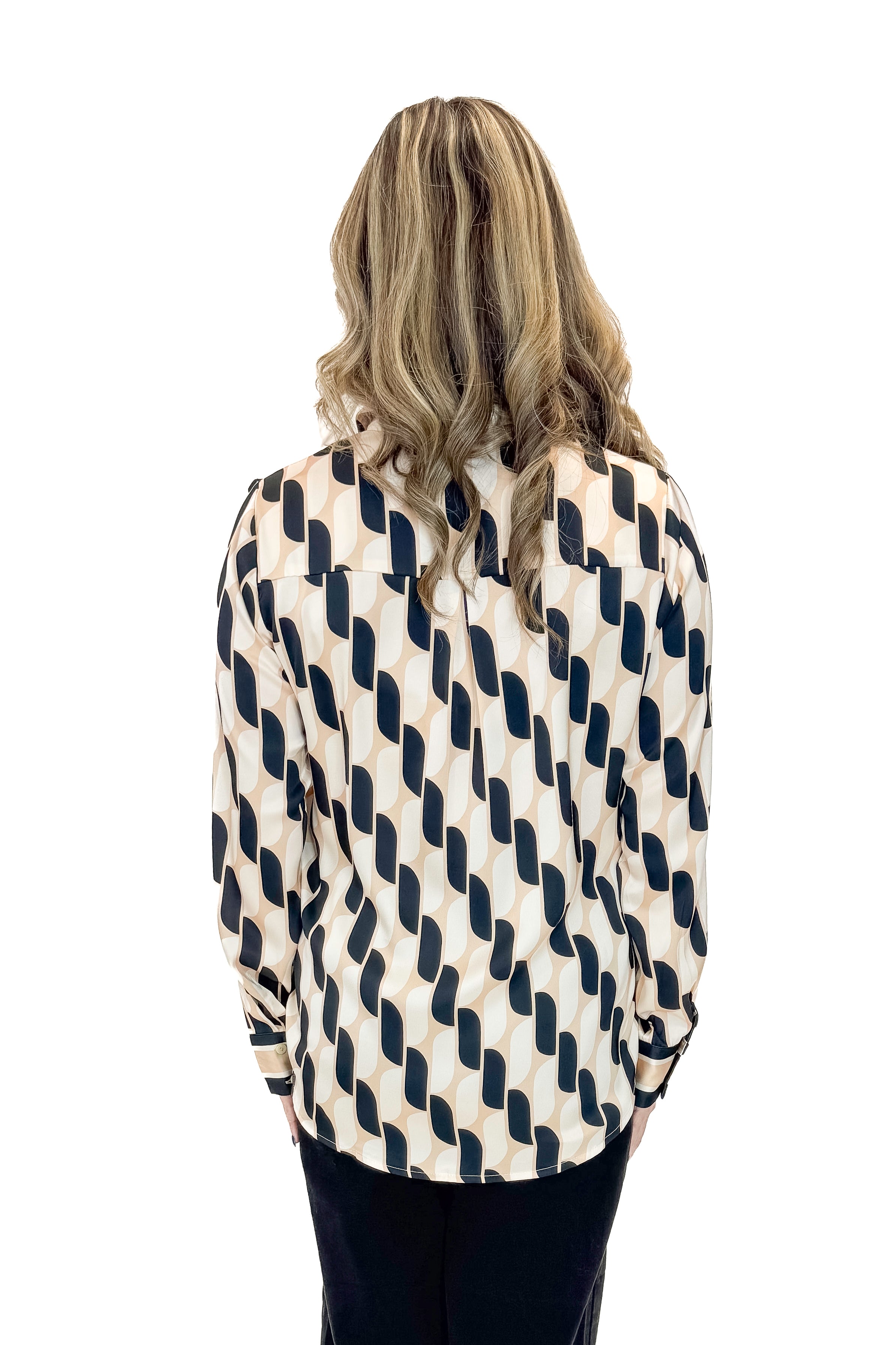 Back view of woman wearing Cream & Black Abstract Print Button Up Top with jeans against white studio background.
