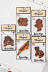 Collection of wooden magnet designs on packaging with &