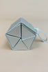 Silver geometric jewelry case on a beige background