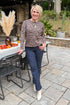 Outside picture of woman wearing Mocha Leopard Crewneck Sweater and jeans.