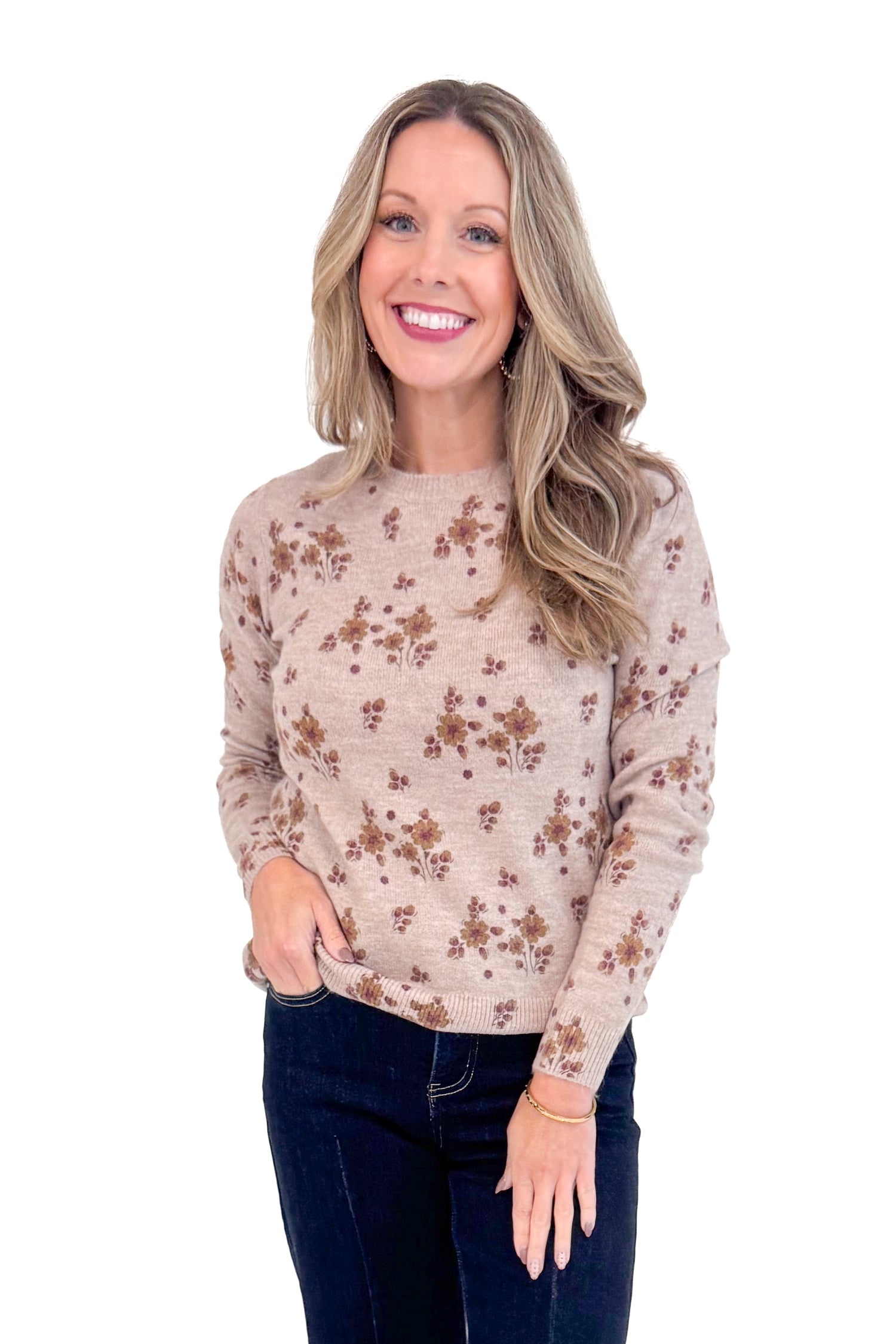 Woman wearing Blush Floral Print Sweater and jeans.
