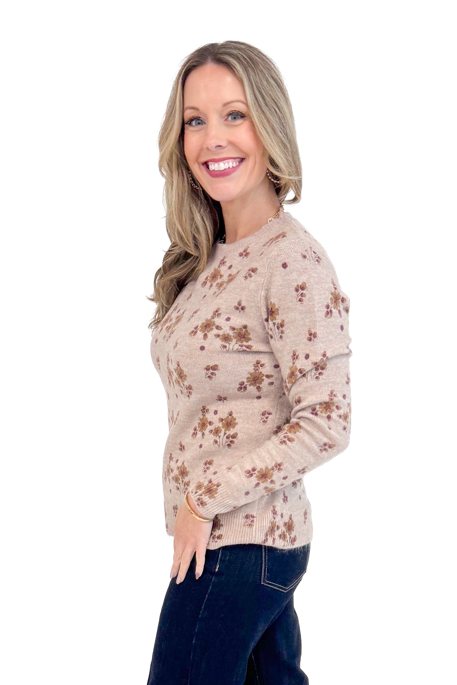 Side view of woman wearing Blush Floral Print Sweater and jeans.