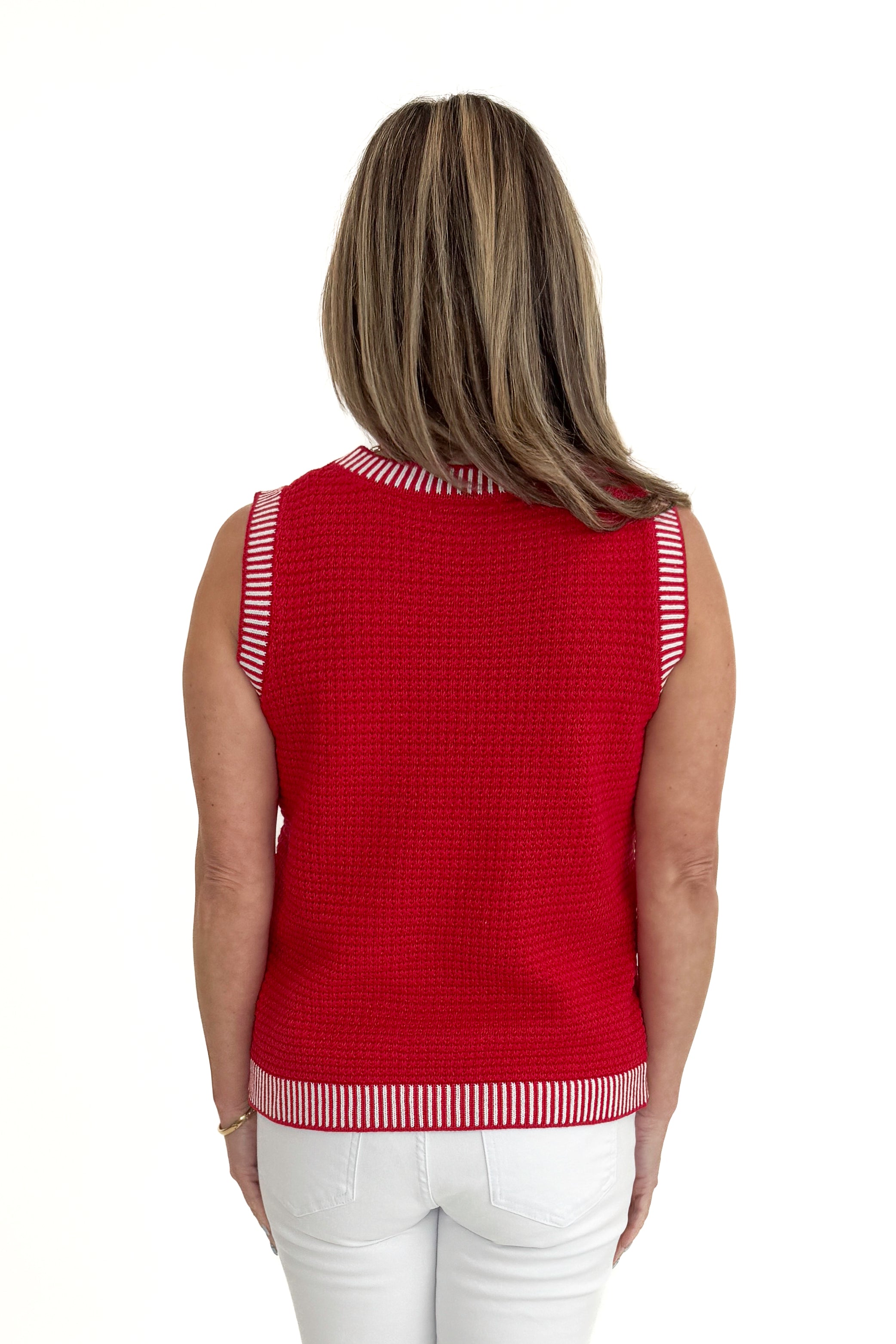 Back view of woman wearing Red & White Textured Sweater Tank with jeans against white studio background.