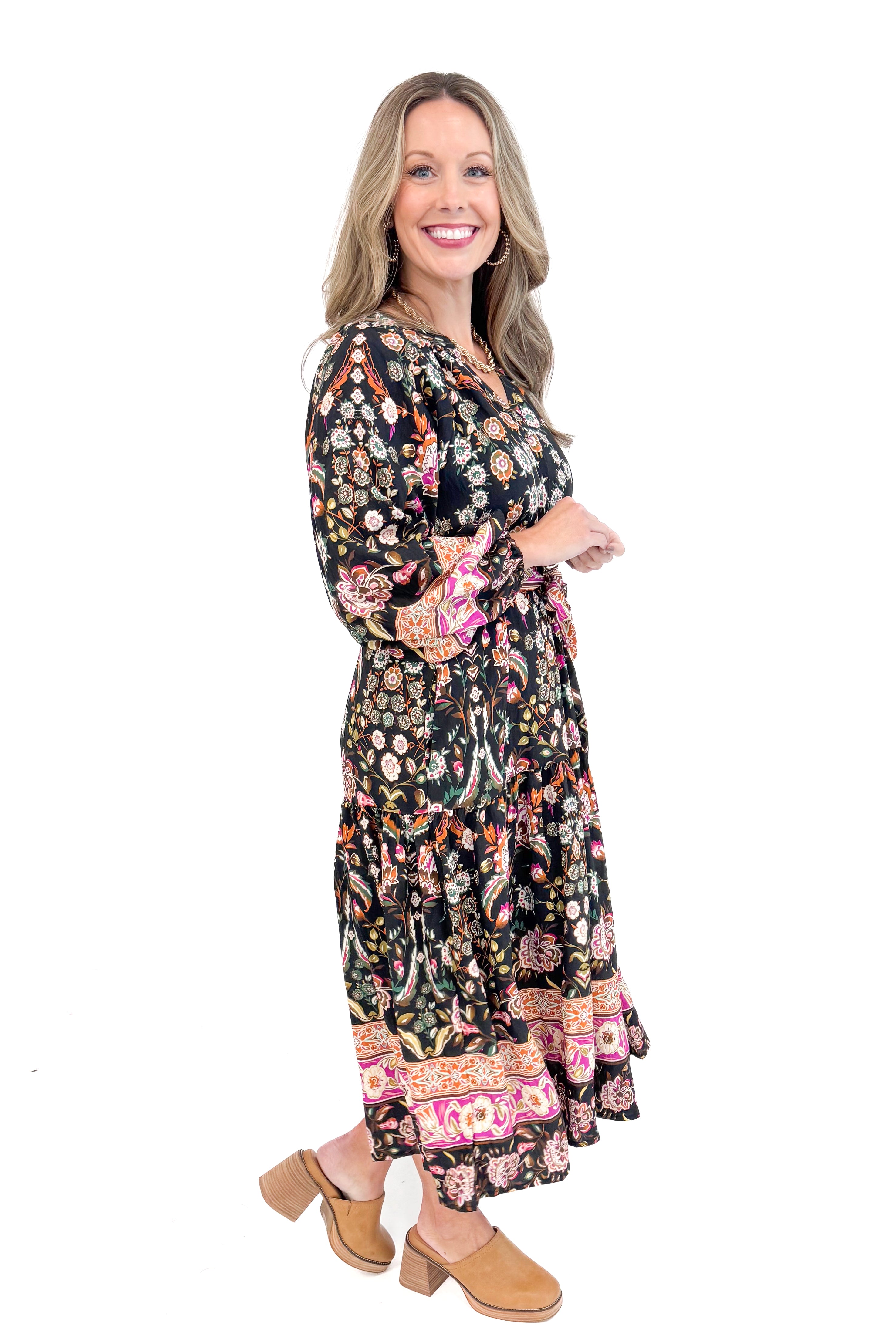 Side view of woman wearing Black & Multi Printed Midi Dress with white studio background.