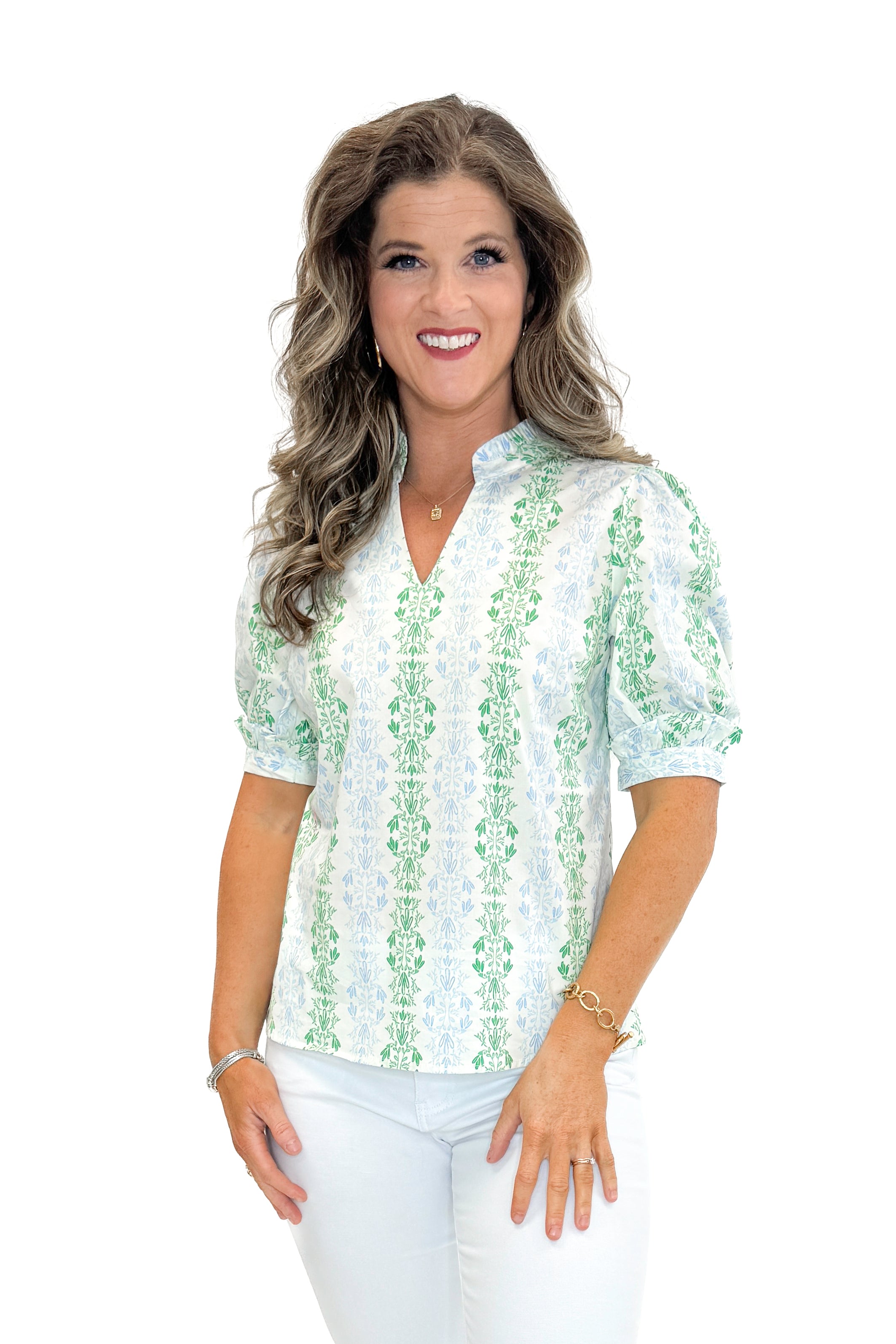 Front view of woman wearing Blue & Green Vine Print Colette Top by Mary Square with jeans against white studio background.