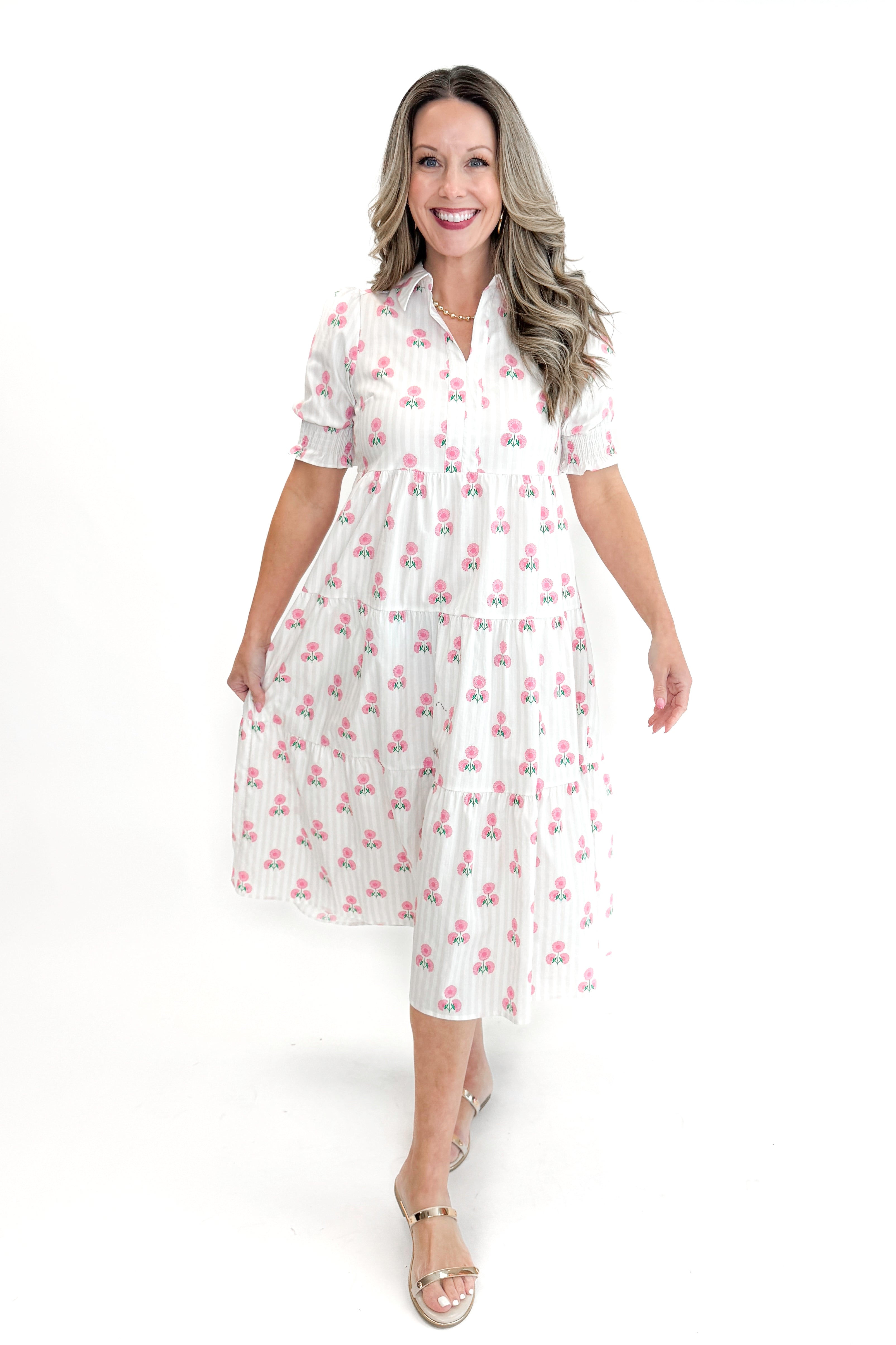 Front view of woman wearing Neutral Stripe & Pink Floral Molly Dress by Mary Square with sandals against white studio background.
