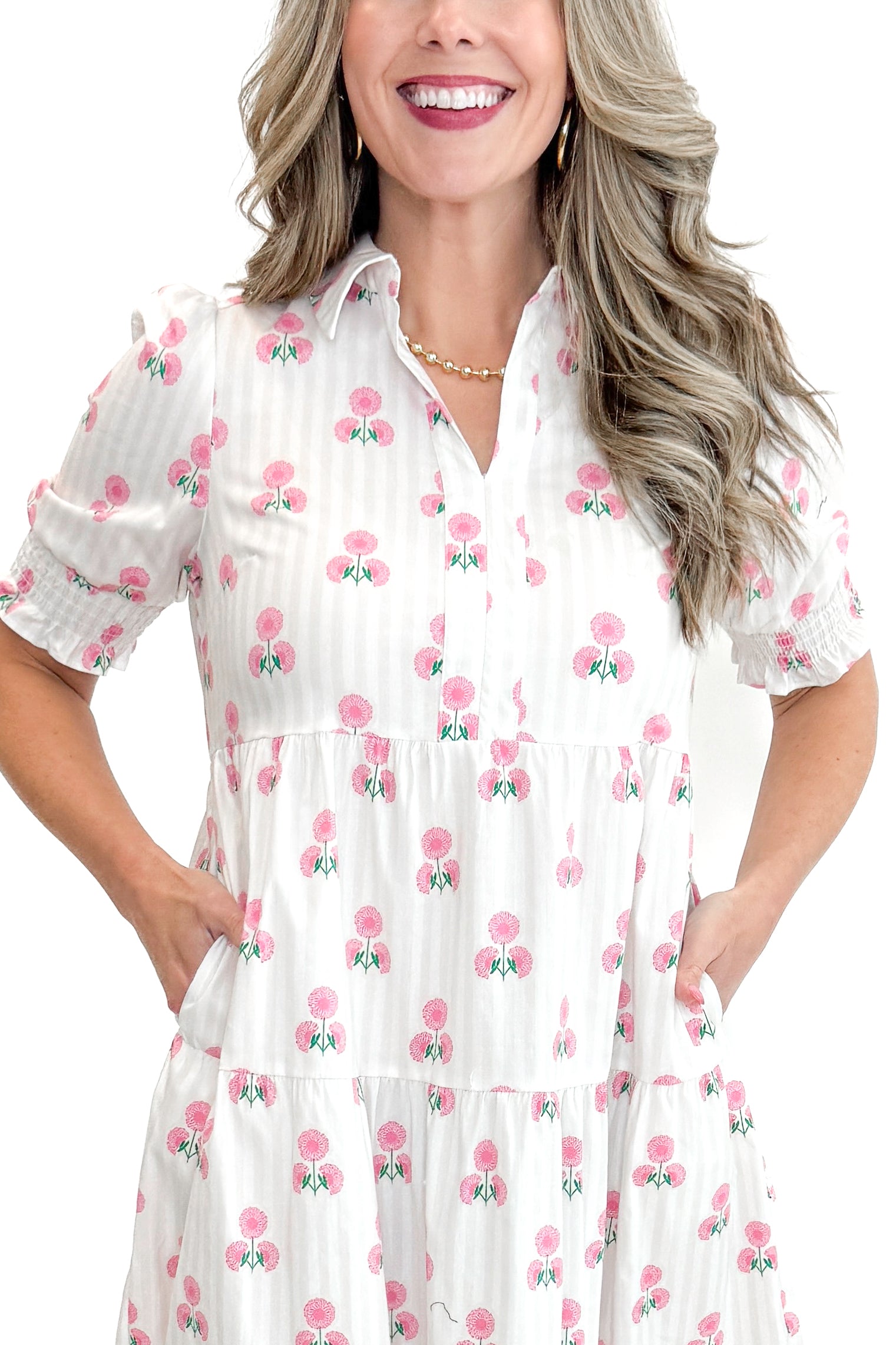 Front detail view of woman wearing Neutral Stripe & Pink Floral Molly Dress by Mary Square with sandals against white studio background.