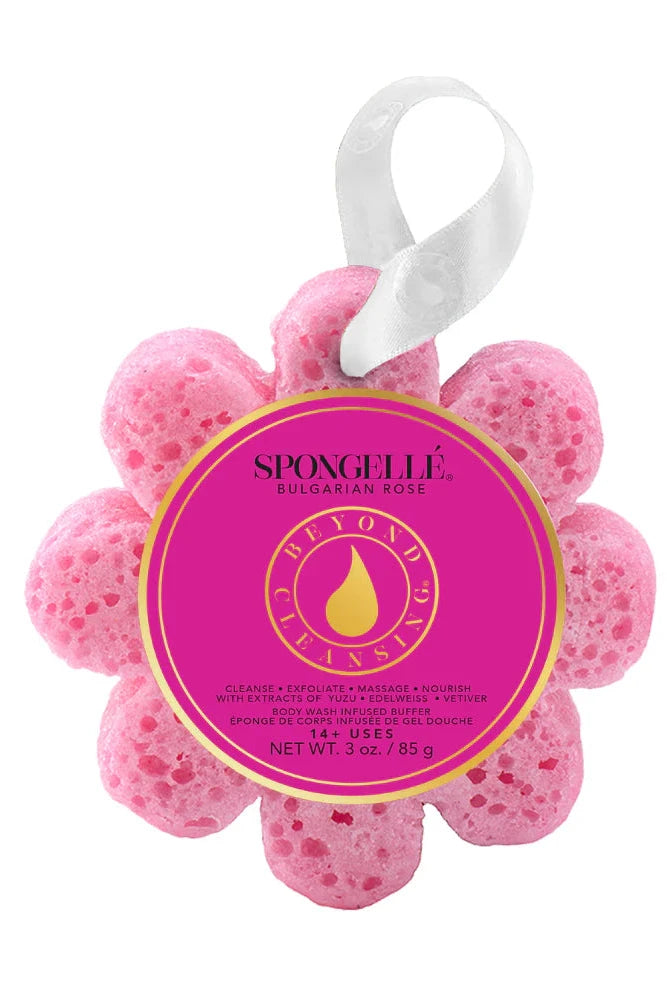 Pink flower-shaped sponge with a label on a white background