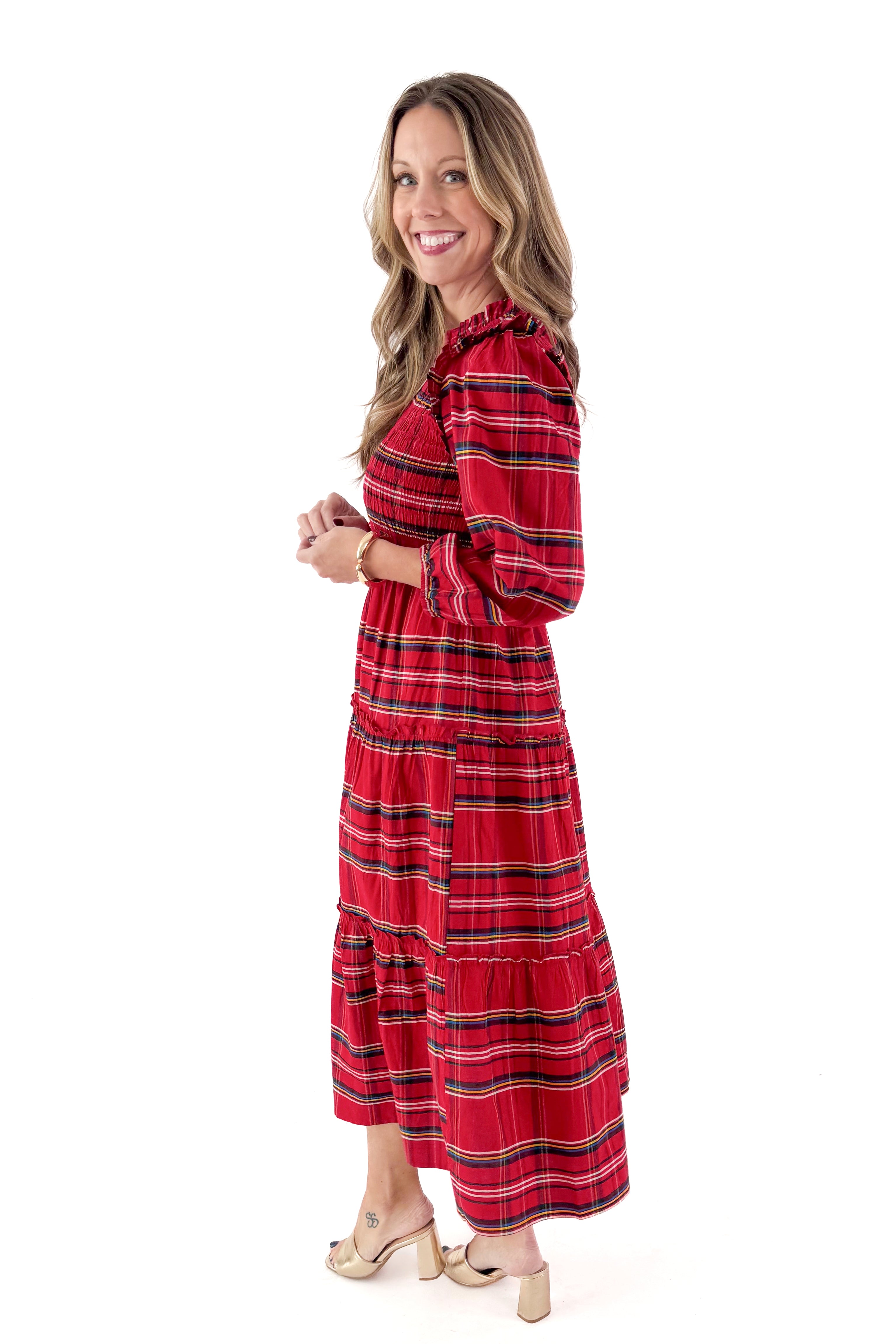 Side view of woman wearing Red Walton Plaid Midi Dress against white studio background.