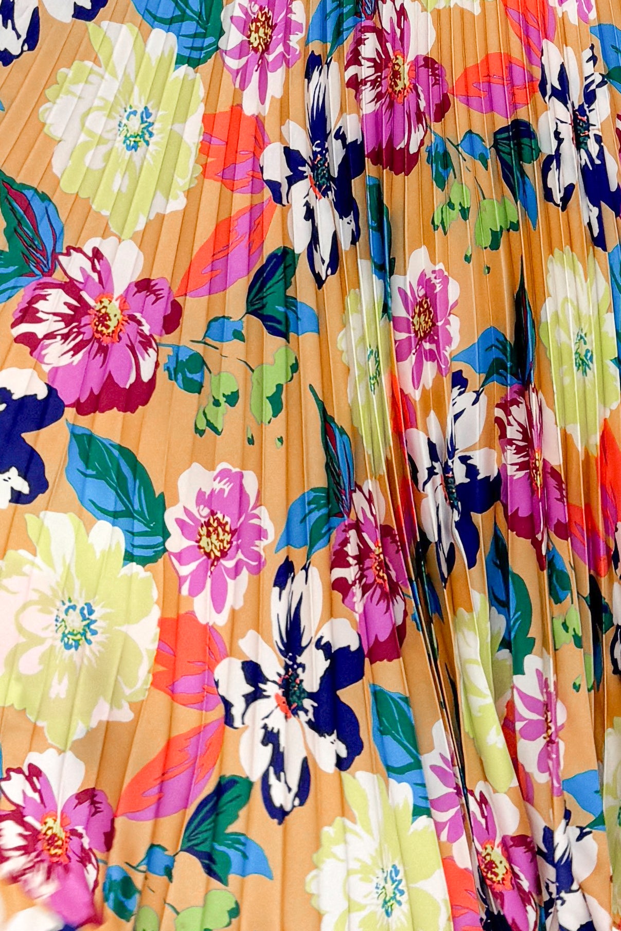 Fabric view of woman wearing Taupe & Multi Floral Print Pleated Midi Dress by Skies Are Blue