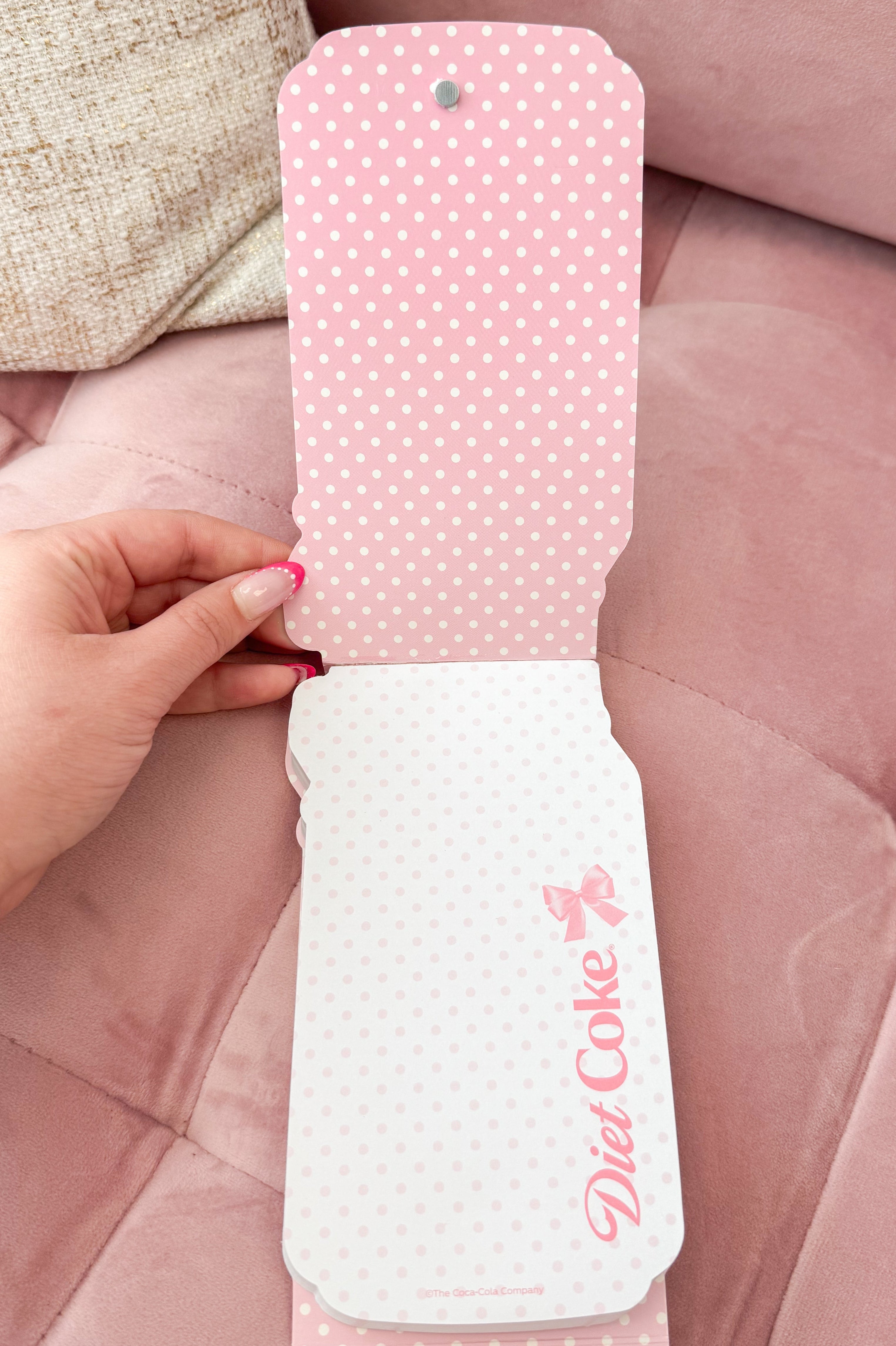 Pink and white polka dot inside of pocket notepad with &