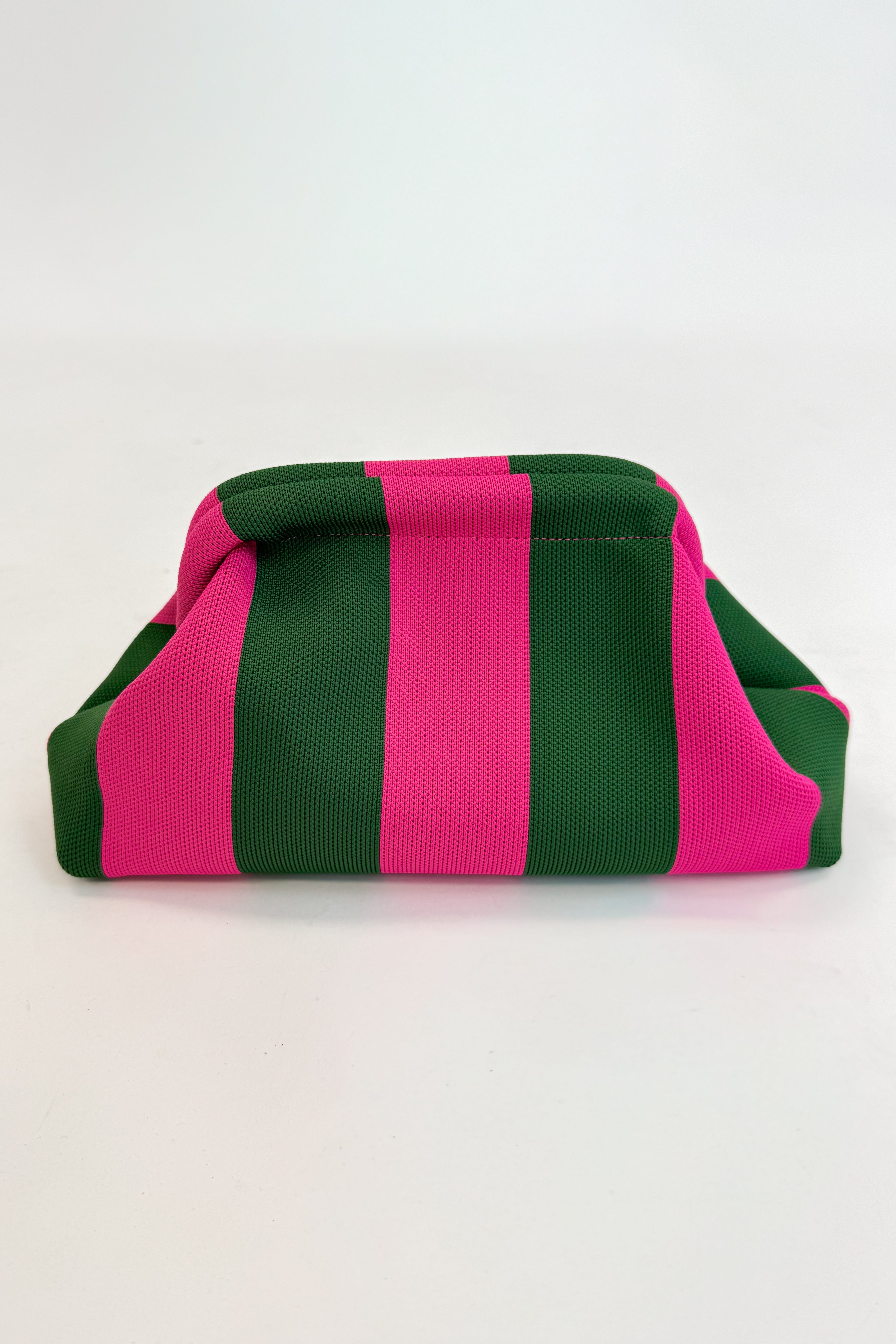 Green and pink striped fabric on a white background