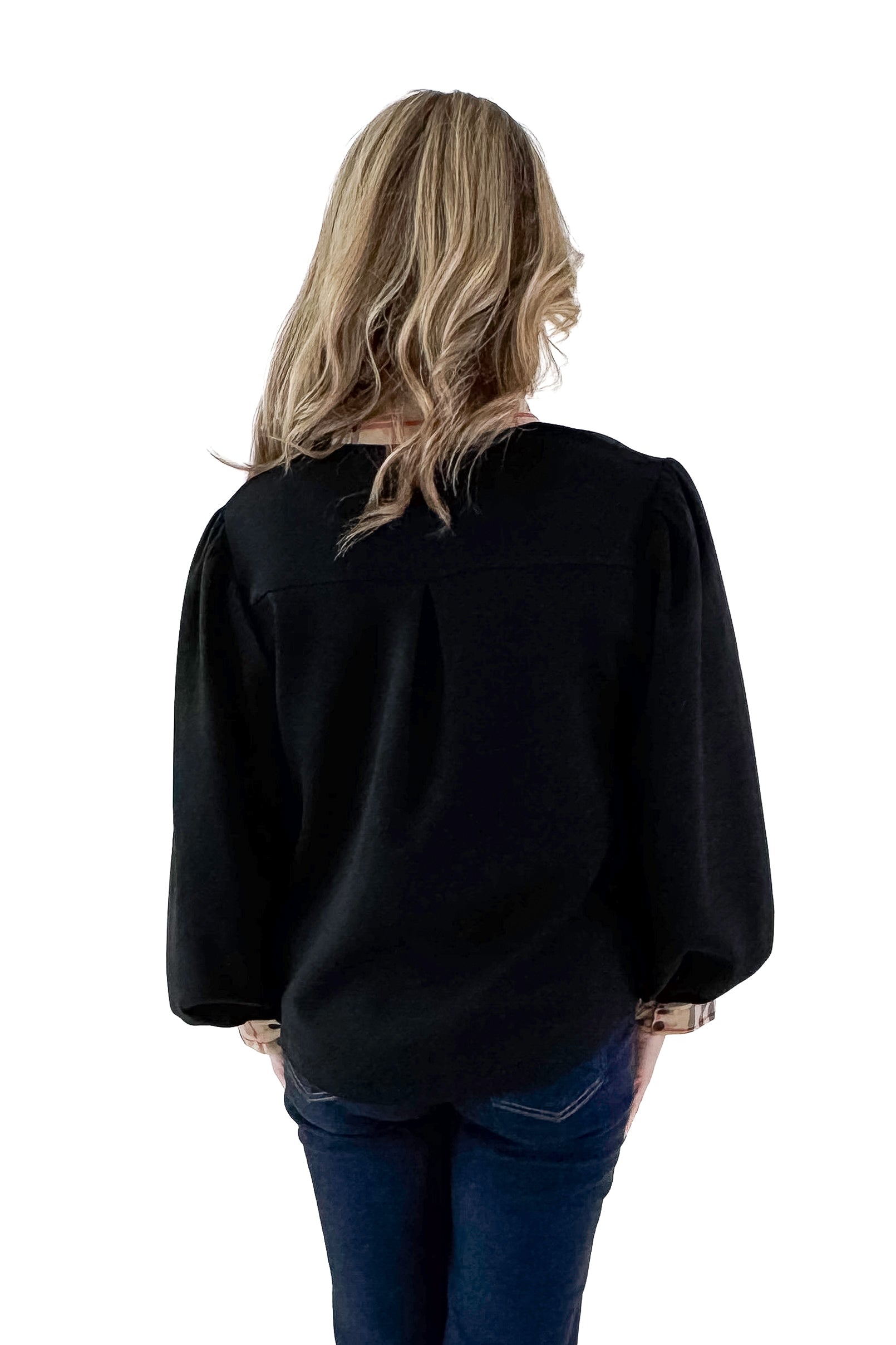 Back view of woman wearing Black With Plaid Contrast Detail Top with jeans against white studio background.