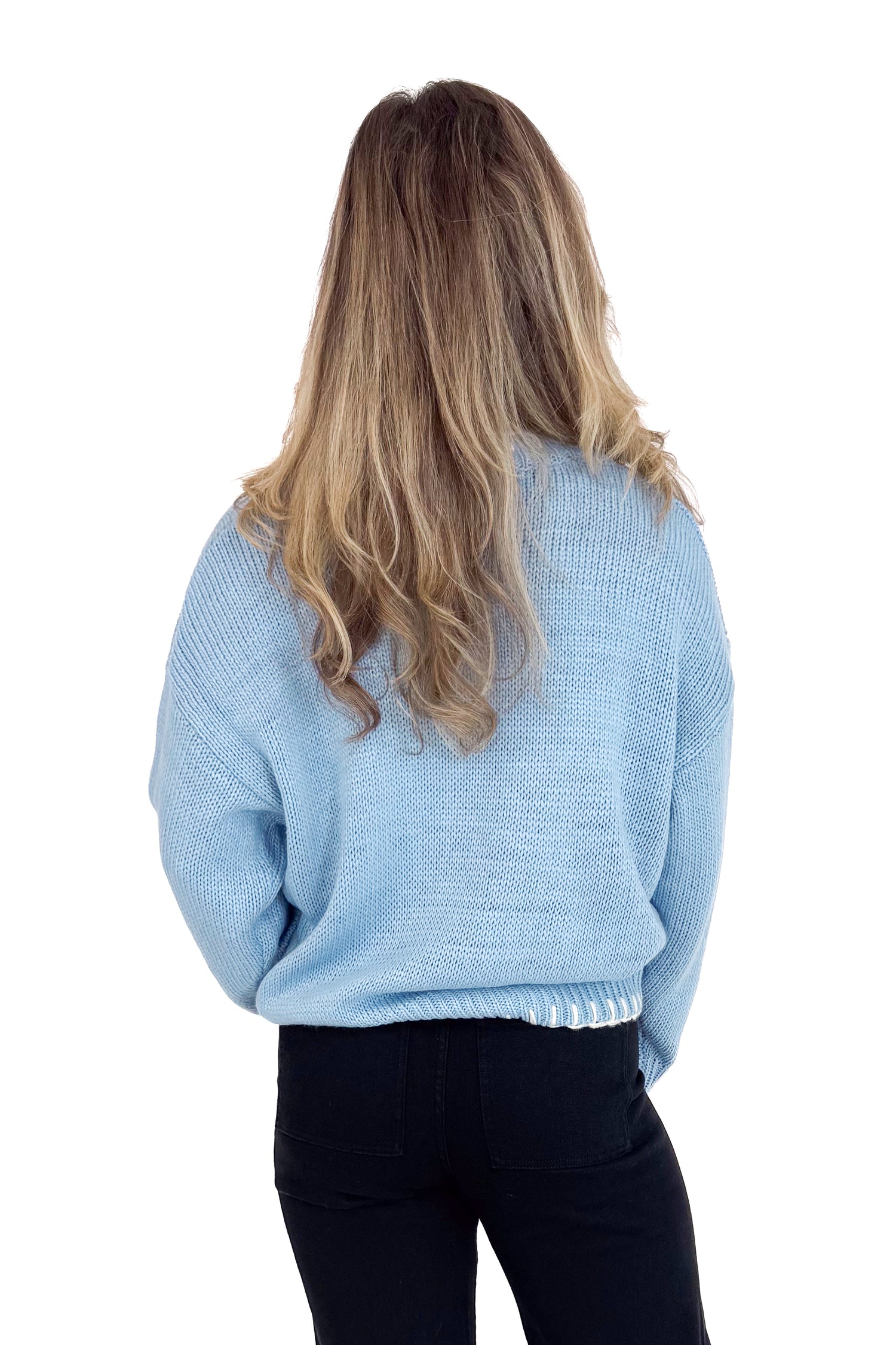 Person wearing a light blue sweater from behind on a white background