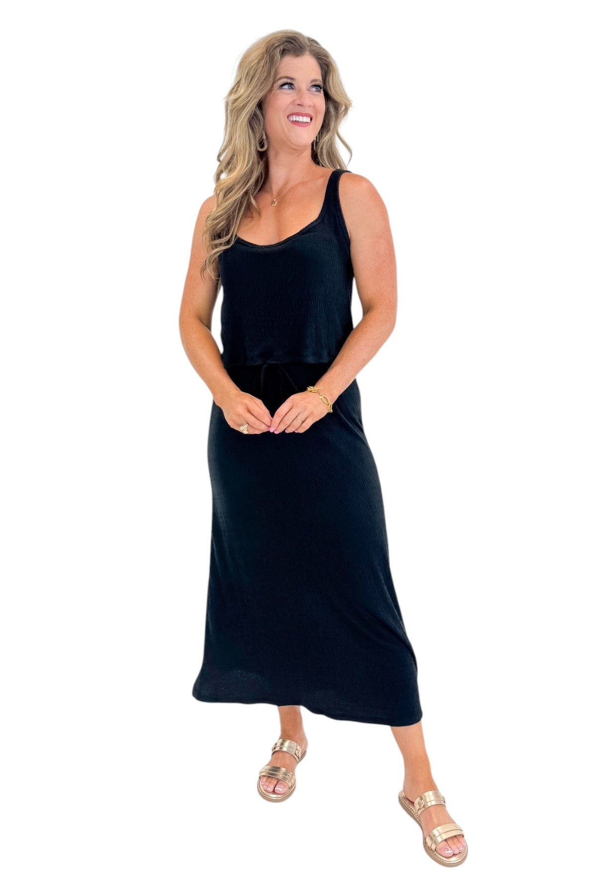 Front view of woman wearing Swagger Boutiqueās Black Joanna Tank by Z Supply with Black Idris Maxi Skirt by Z Supply against white studio background.
