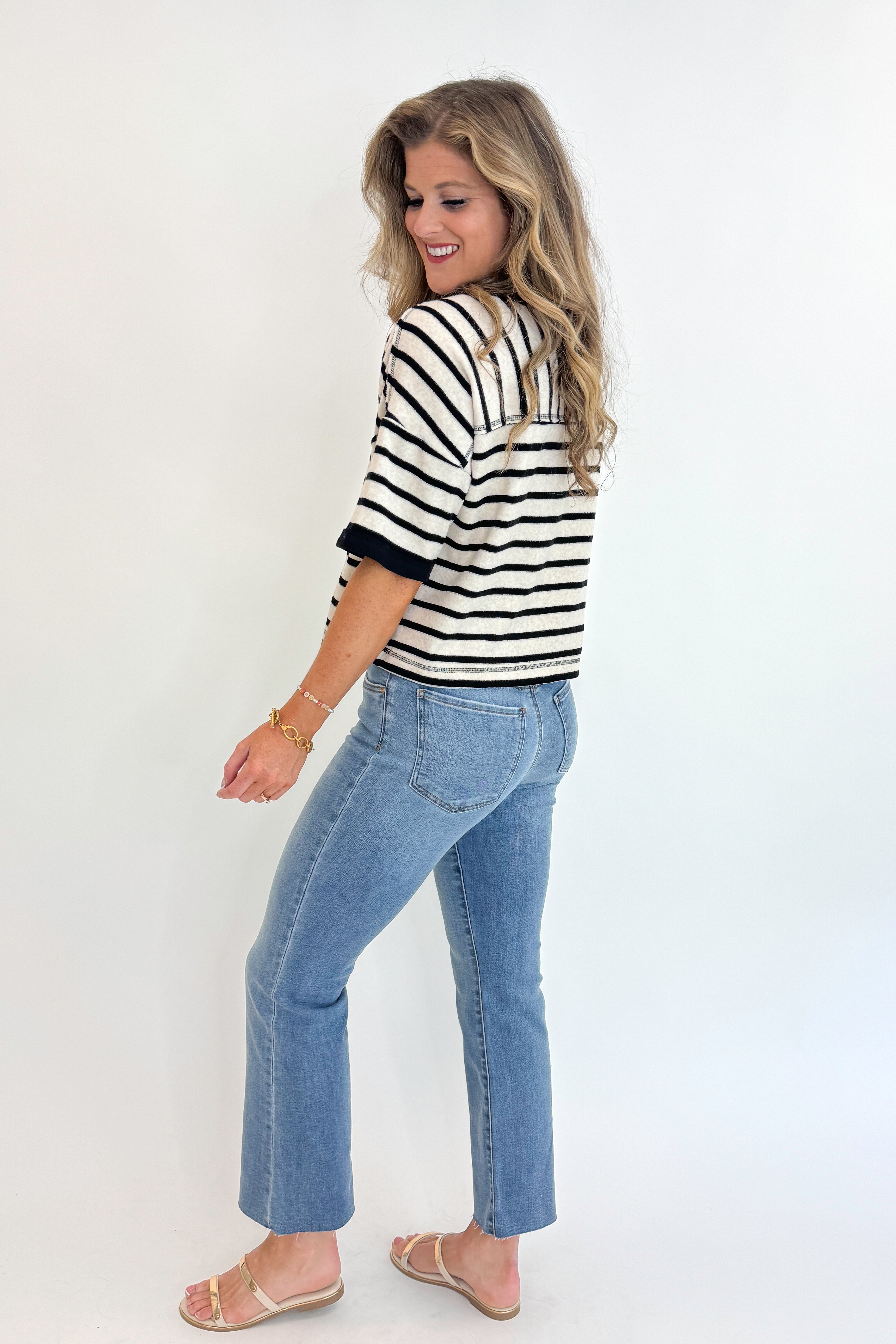 Side view of woman wearing Swagger Boutique&