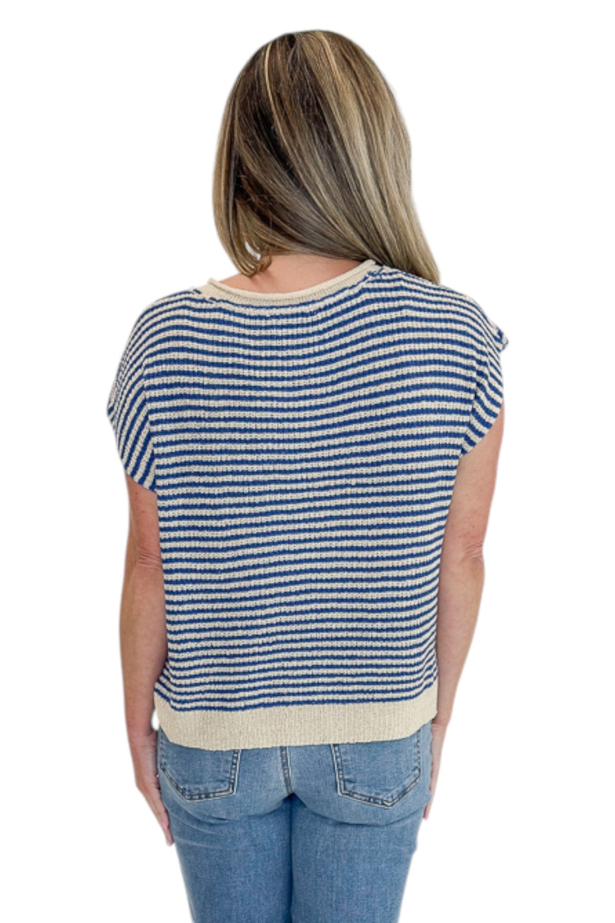 Back view of woman wearing Swagger Boutiqueās Blue & Beige Striped Sleeveless Sweater with jeans against white studio background.