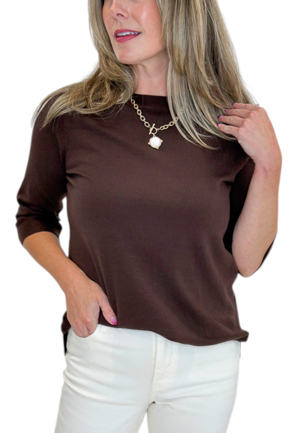 Front detail view of woman wearing Swagger Boutique’s Brown Lightweight Half Sleeve Sweater with jeans against white studio background.