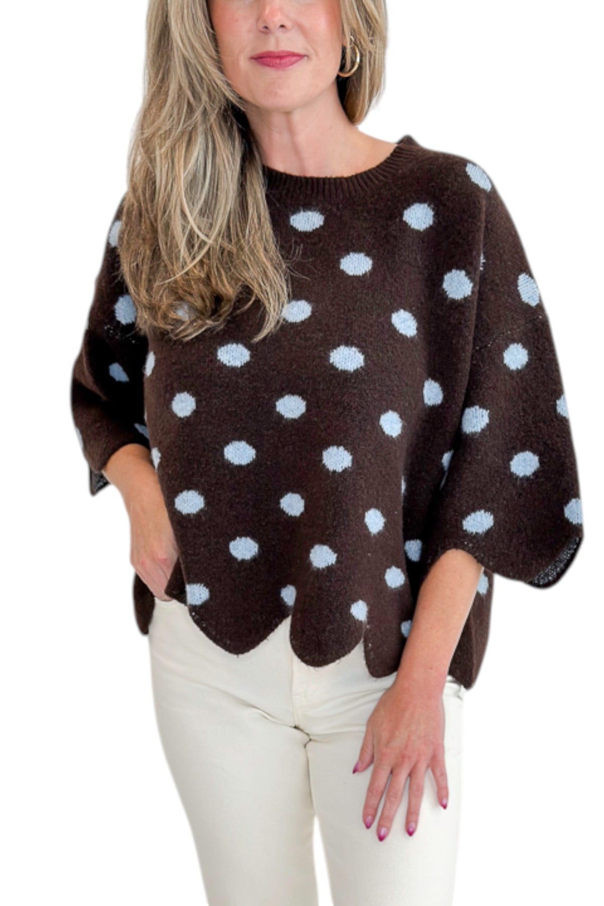 Front detail view of woman wearing Swagger Boutiqueās Brown Polka Dot Short Sleeve Sweater by Entro with jeans against white studio background.