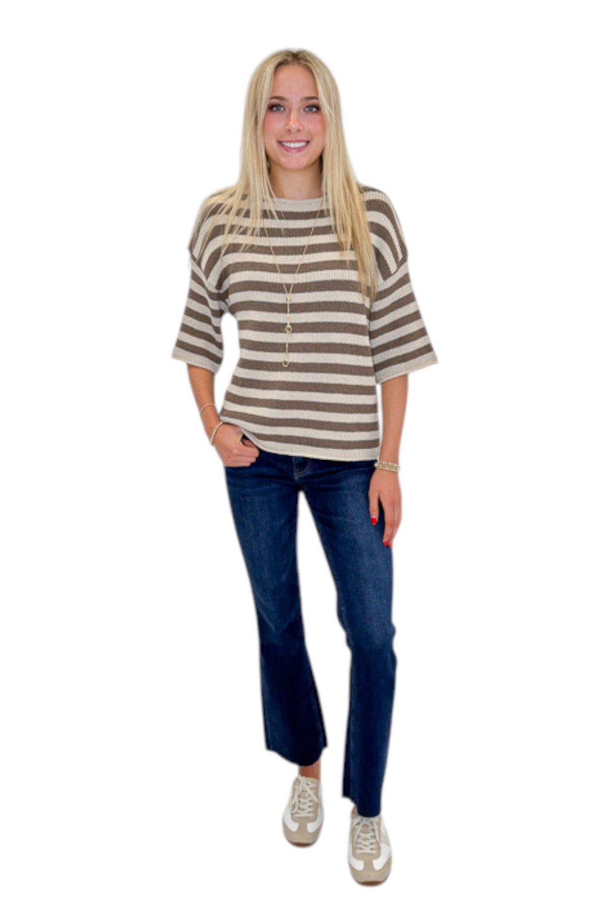 Front view of woman wearing Swagger Boutique’s Brown & Beige Striped Short Sleeve Sweater with jeans against white studio background.