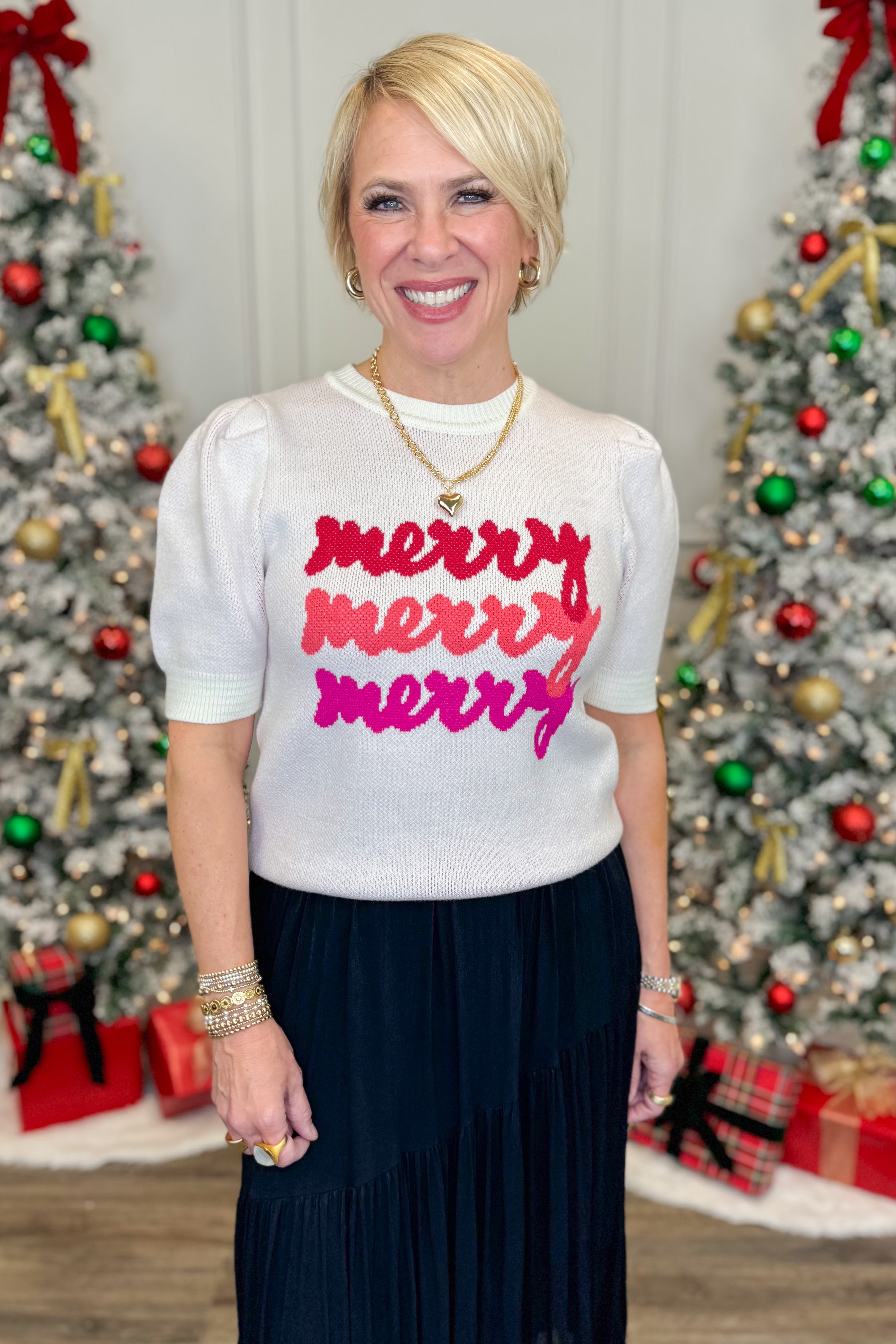 Woman wearing a white sweater with &