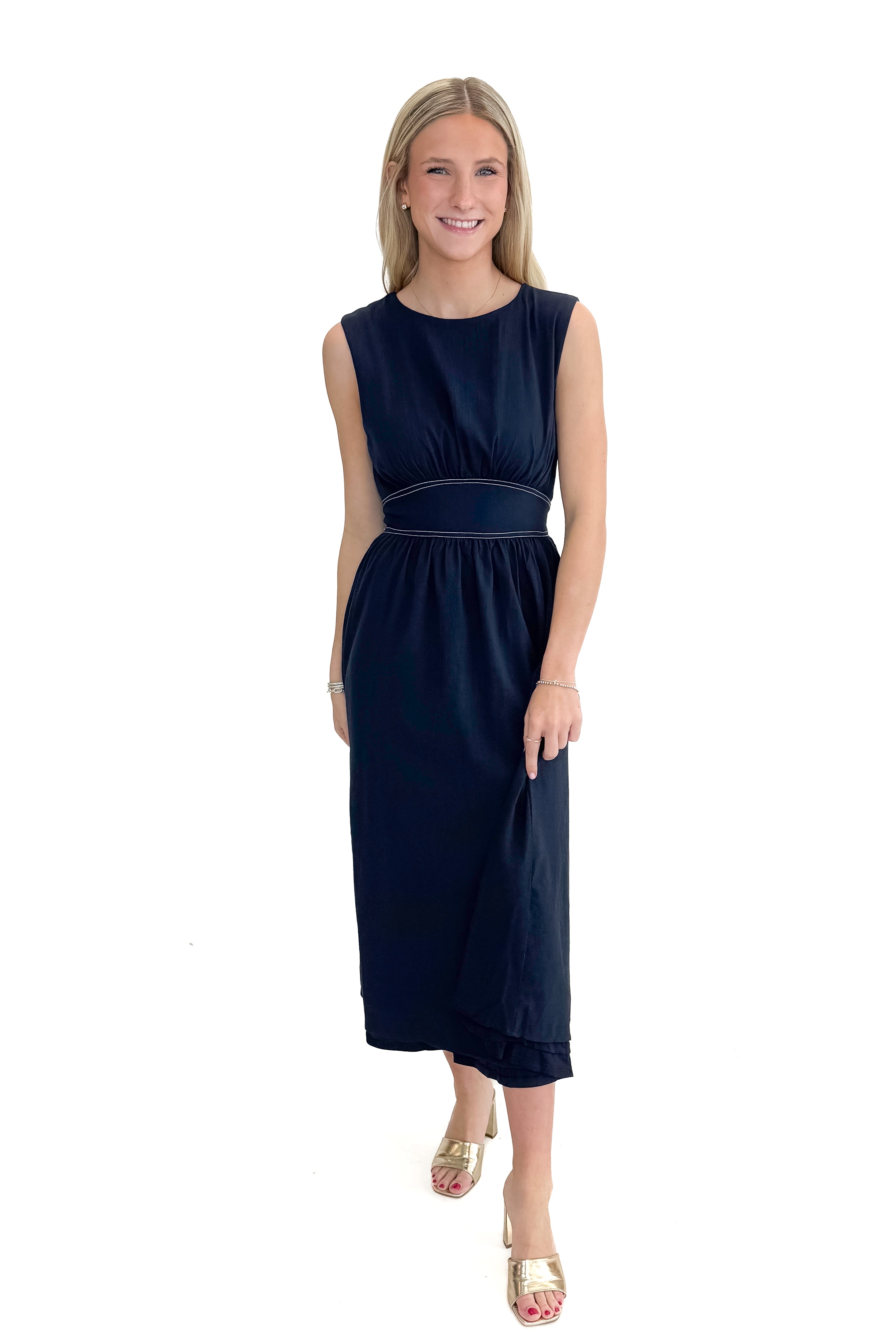 Front view of woman wearing Navy Stitch Waist Mid Dress against white studio background.