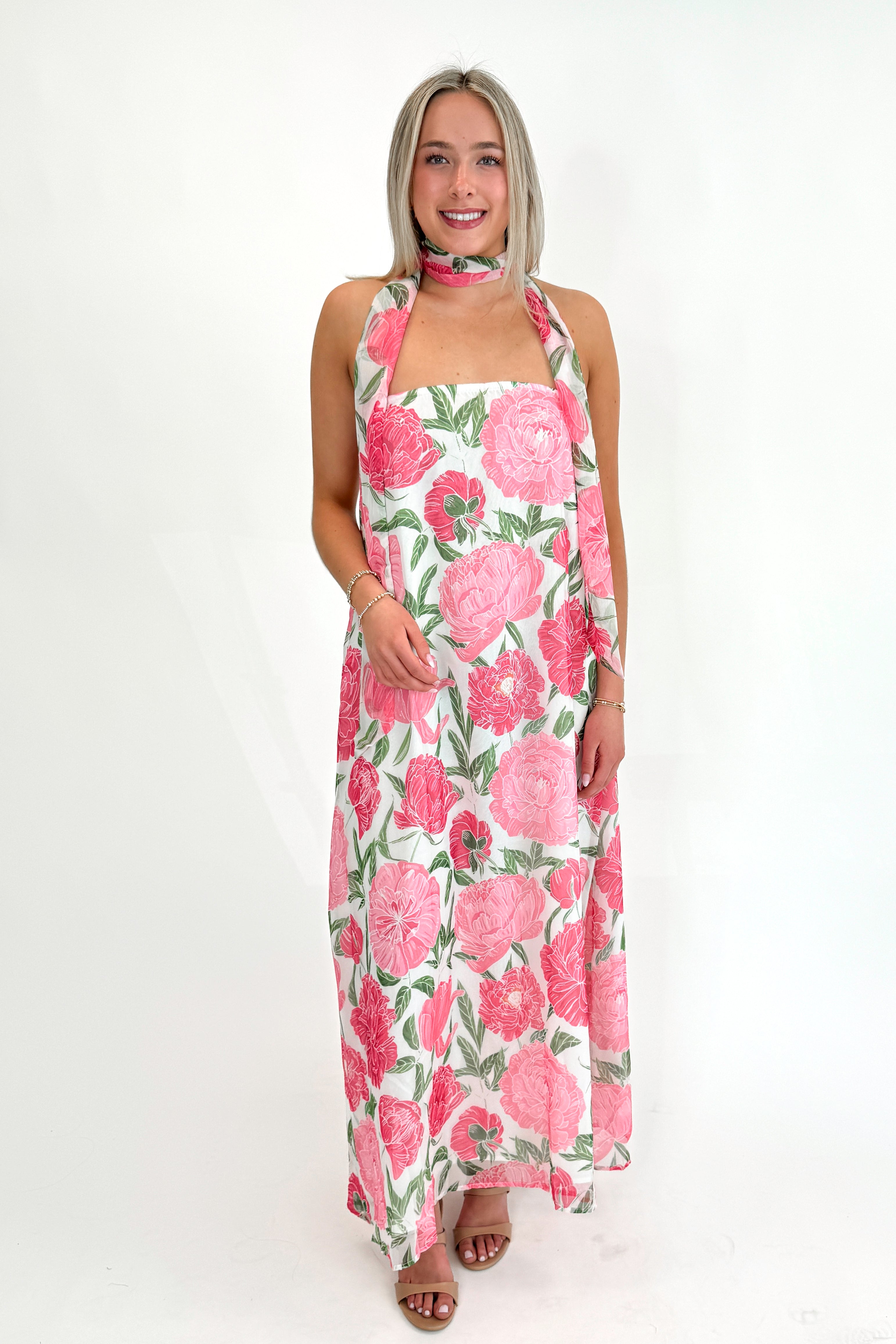 Front view of woman wearing Pink Floral Maxi Dress With Convertible Scarf against white studio background.