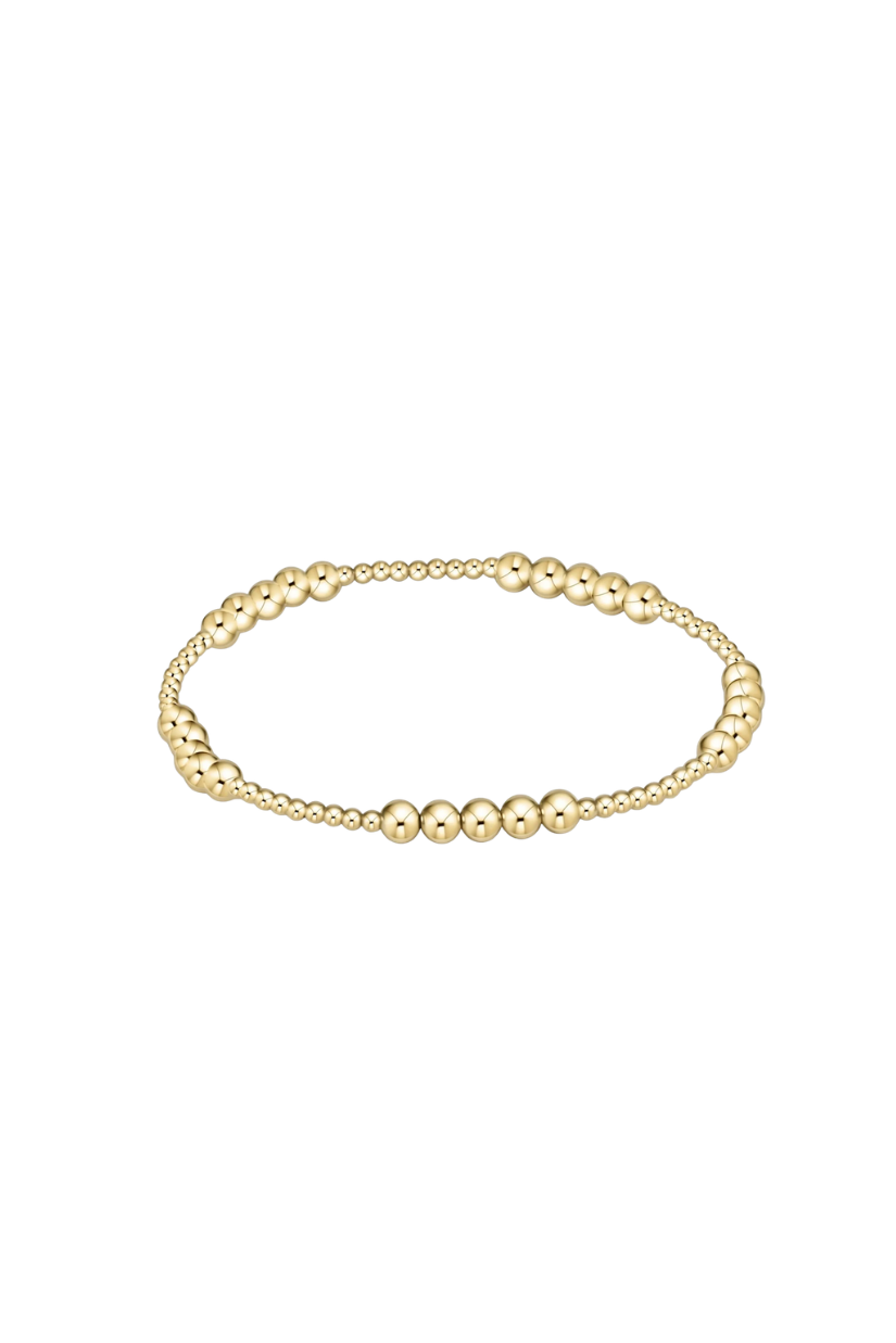 Gold bracelet on a white background
