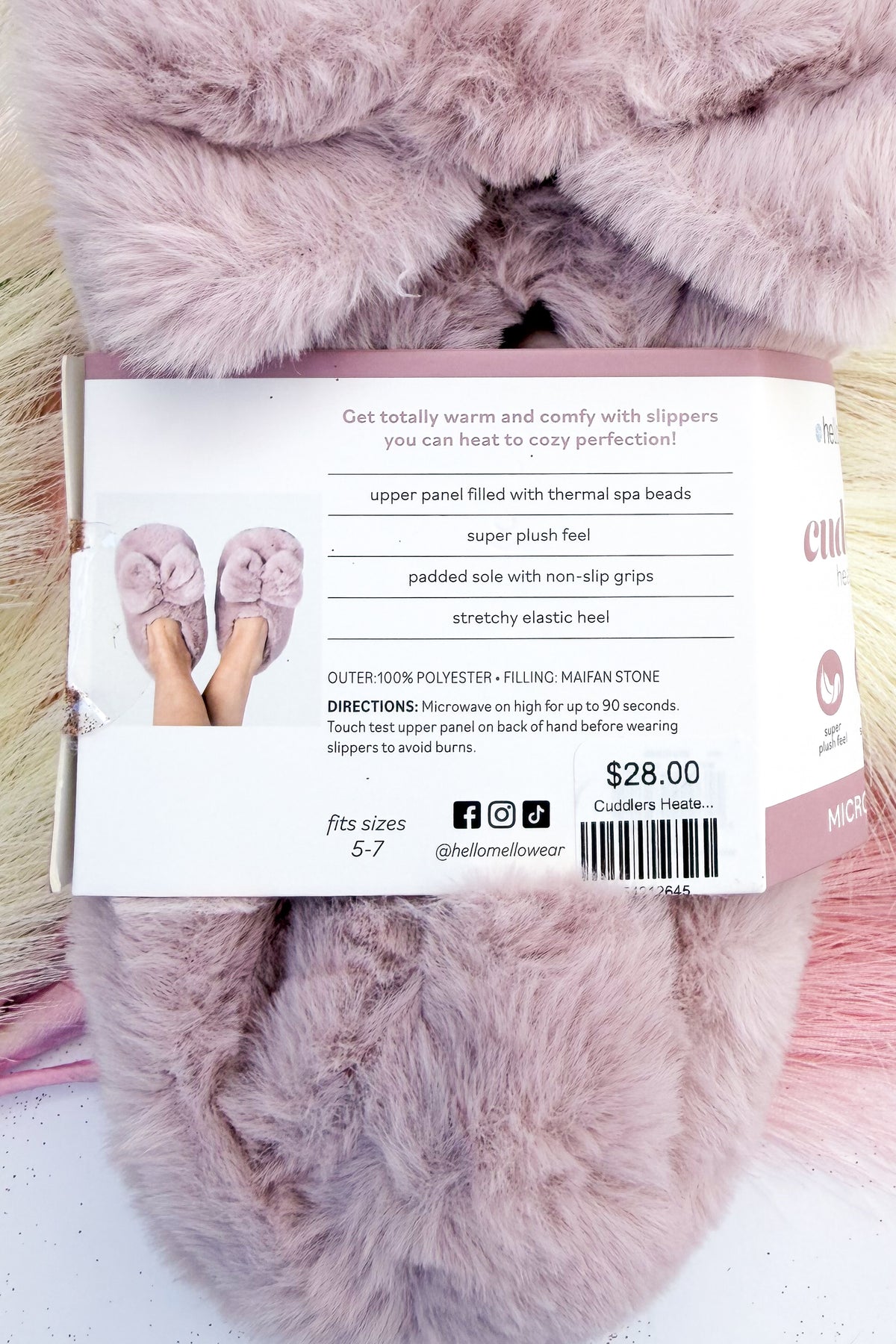 Cuddlers Heated Slippers against studio background.