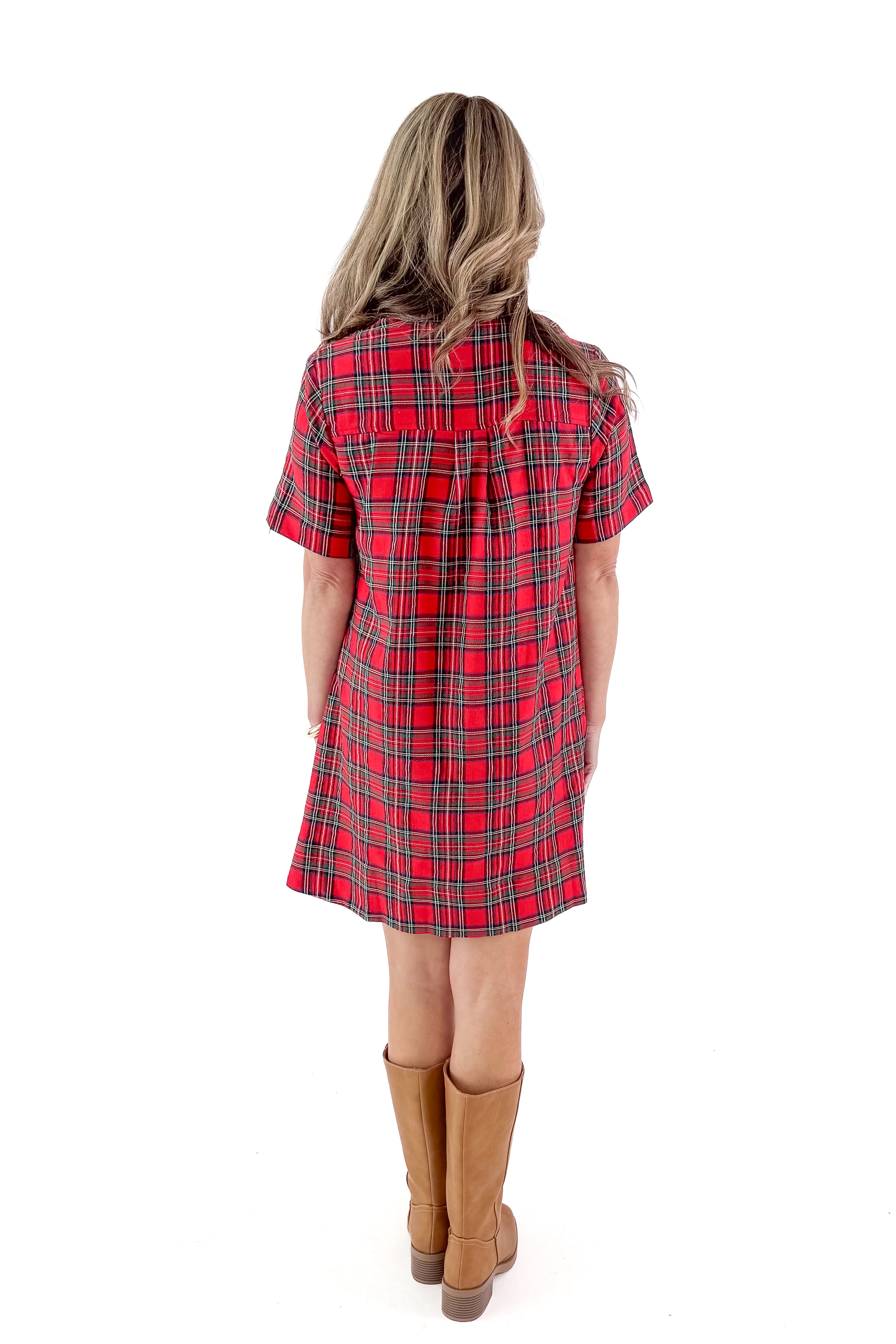 Back view of woman wearing Red Gingham Dress by Entro with boots against white studio background.