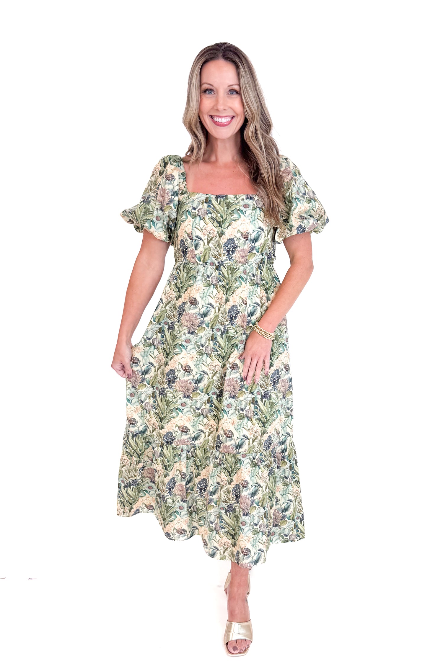 Woman wearing a floral dress on a white background
