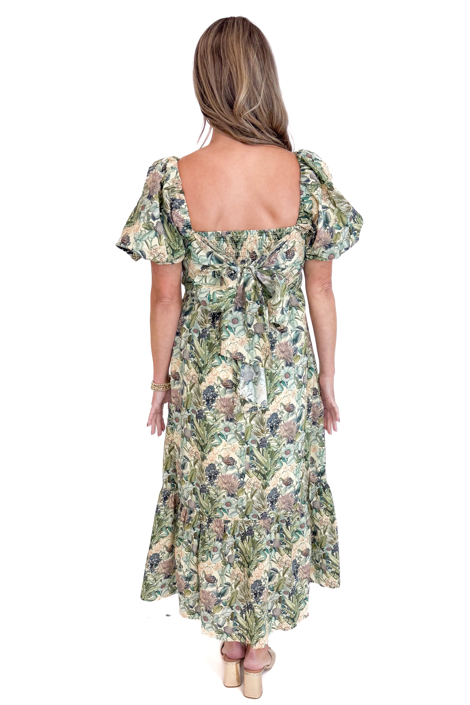 Woman wearing a floral dress with a white background