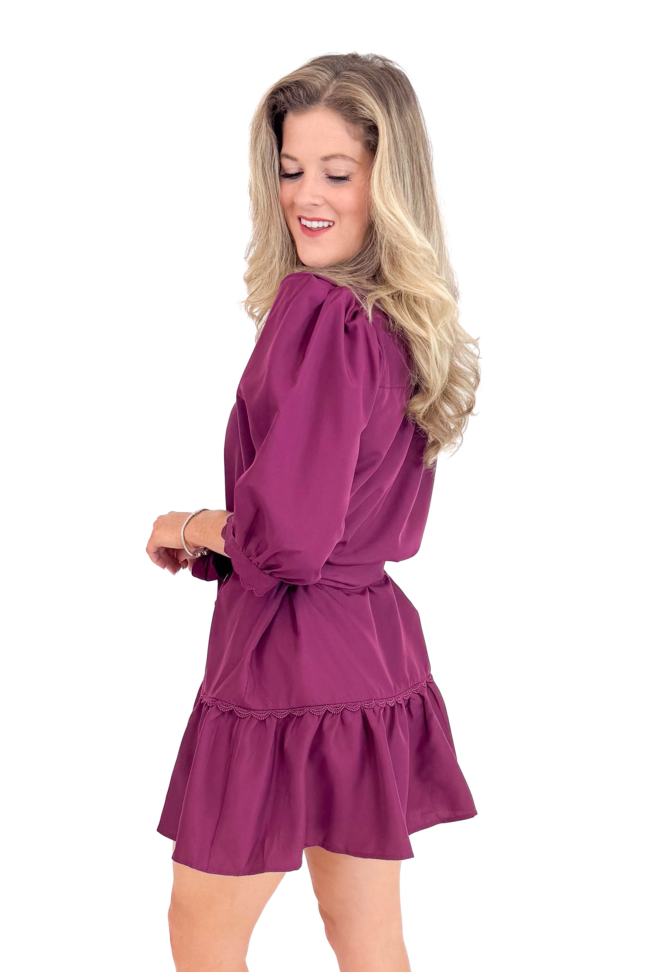 Woman wearing a purple dress on a white background