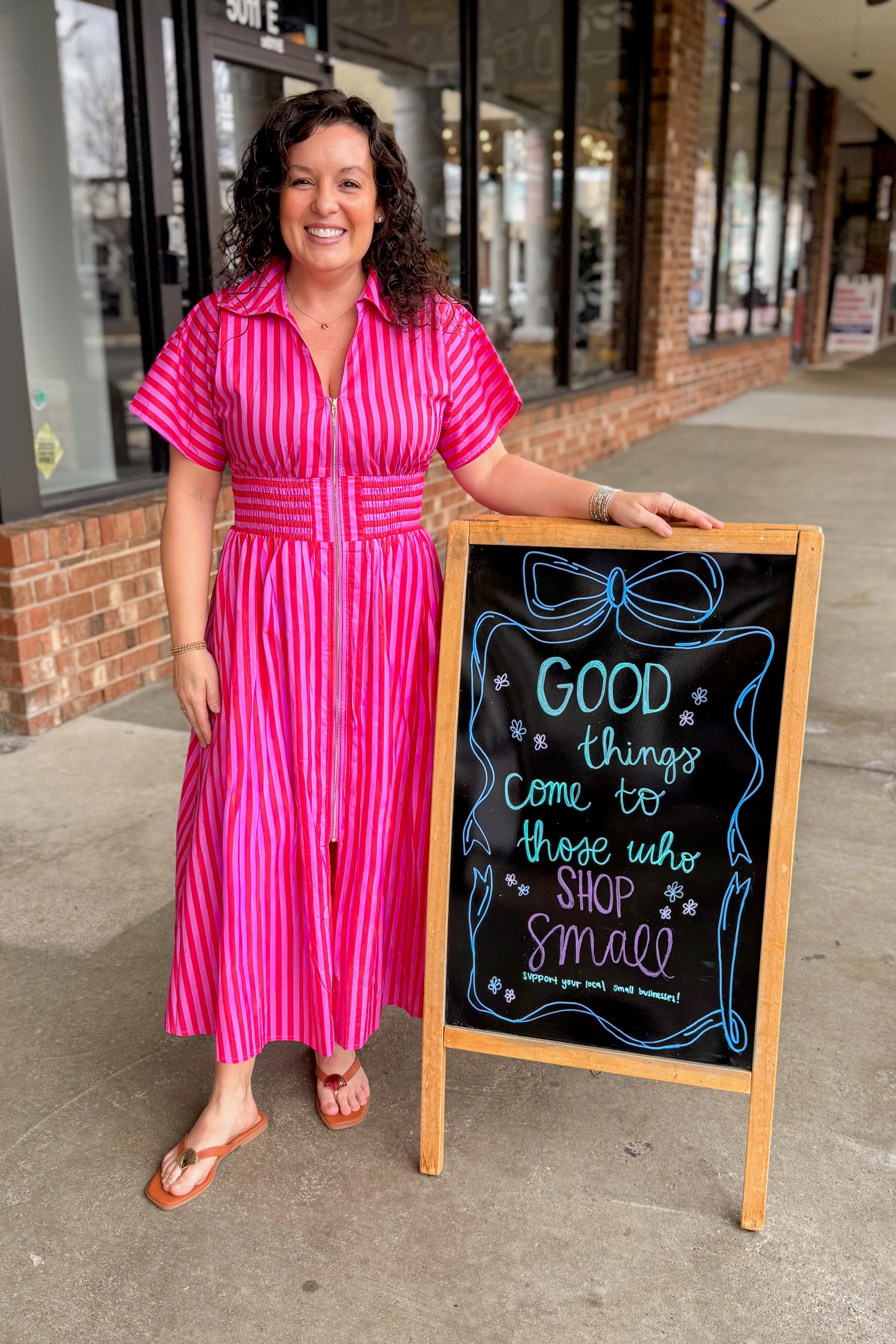 Front view of woman wearing Red & Pink Striped Center Zip Midi Dress by Entro at Swagger Boutique.