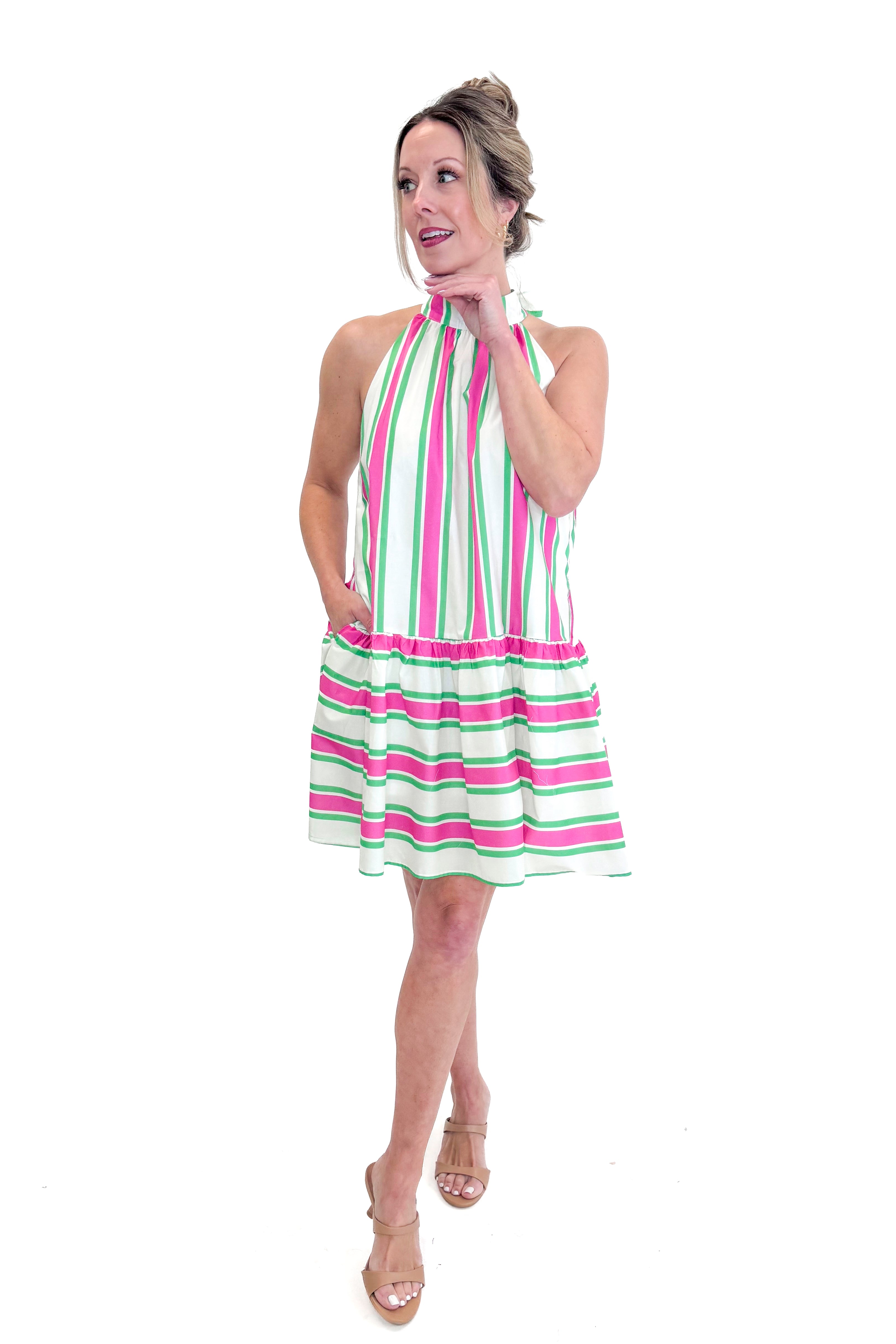 Front view of woman wearing Pink & Green Striped Halter Neck Dress by Entro against white studio background.