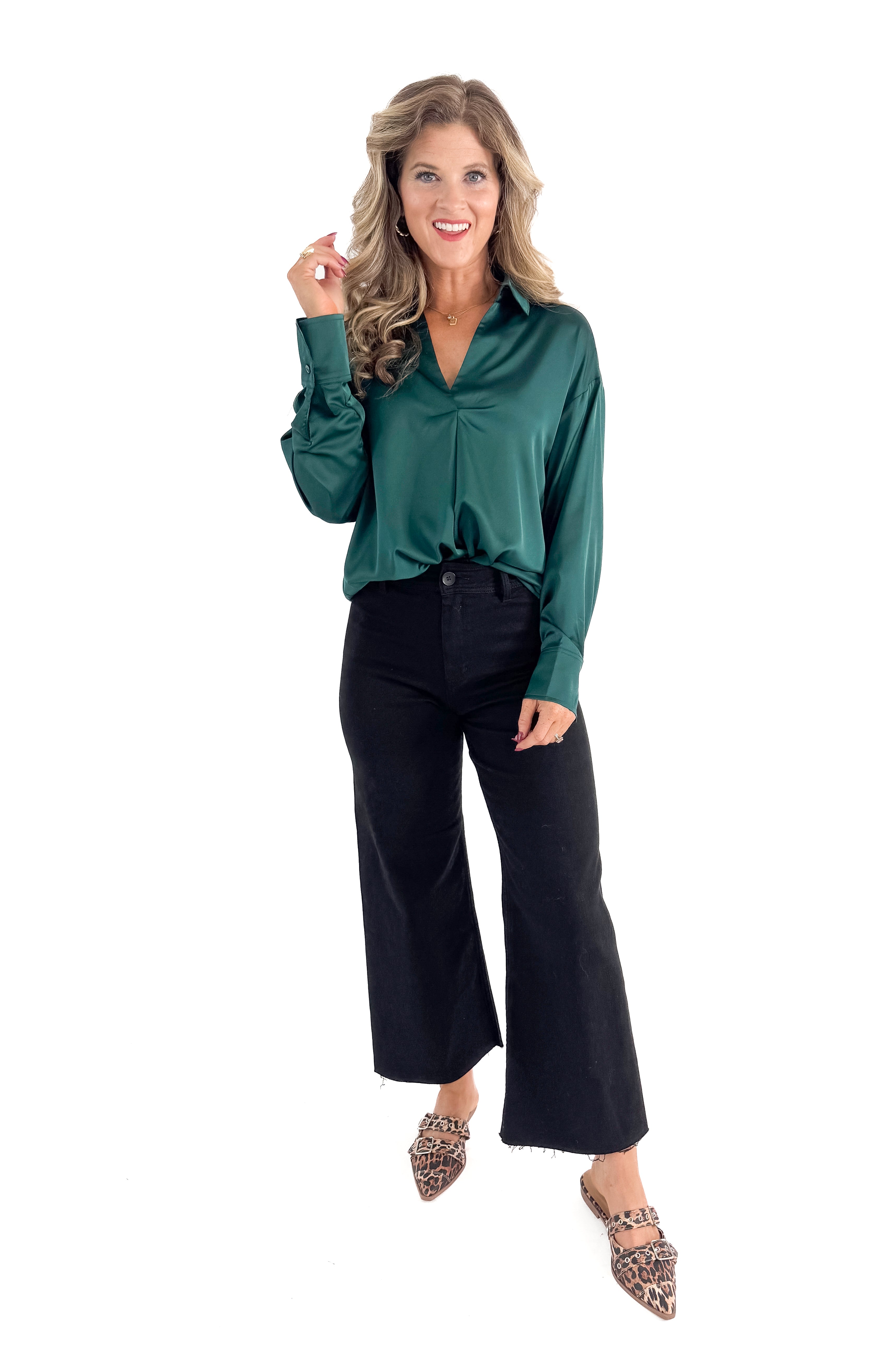 Front view of woman wearing Green Satin Collared V-neck Top with jeans against white studio background.
