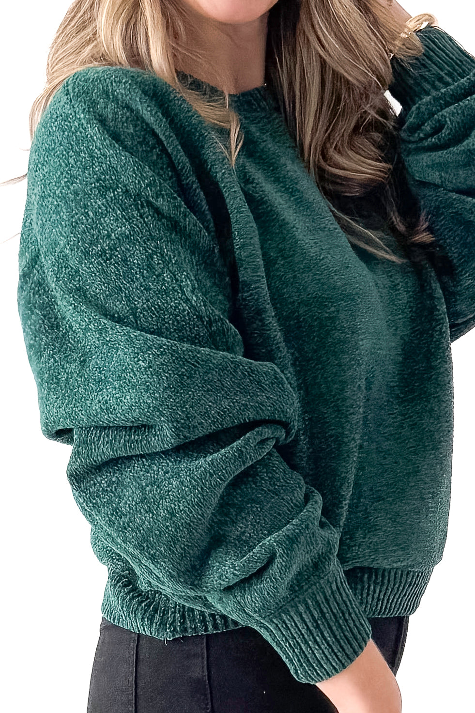 Side detailed view of woman wearing Hunter Green Chenille Sweater with jeans against white studio background.