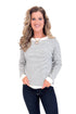 Woman wearing Cream & Black Striped Long Sleeve Top and blue jeans.