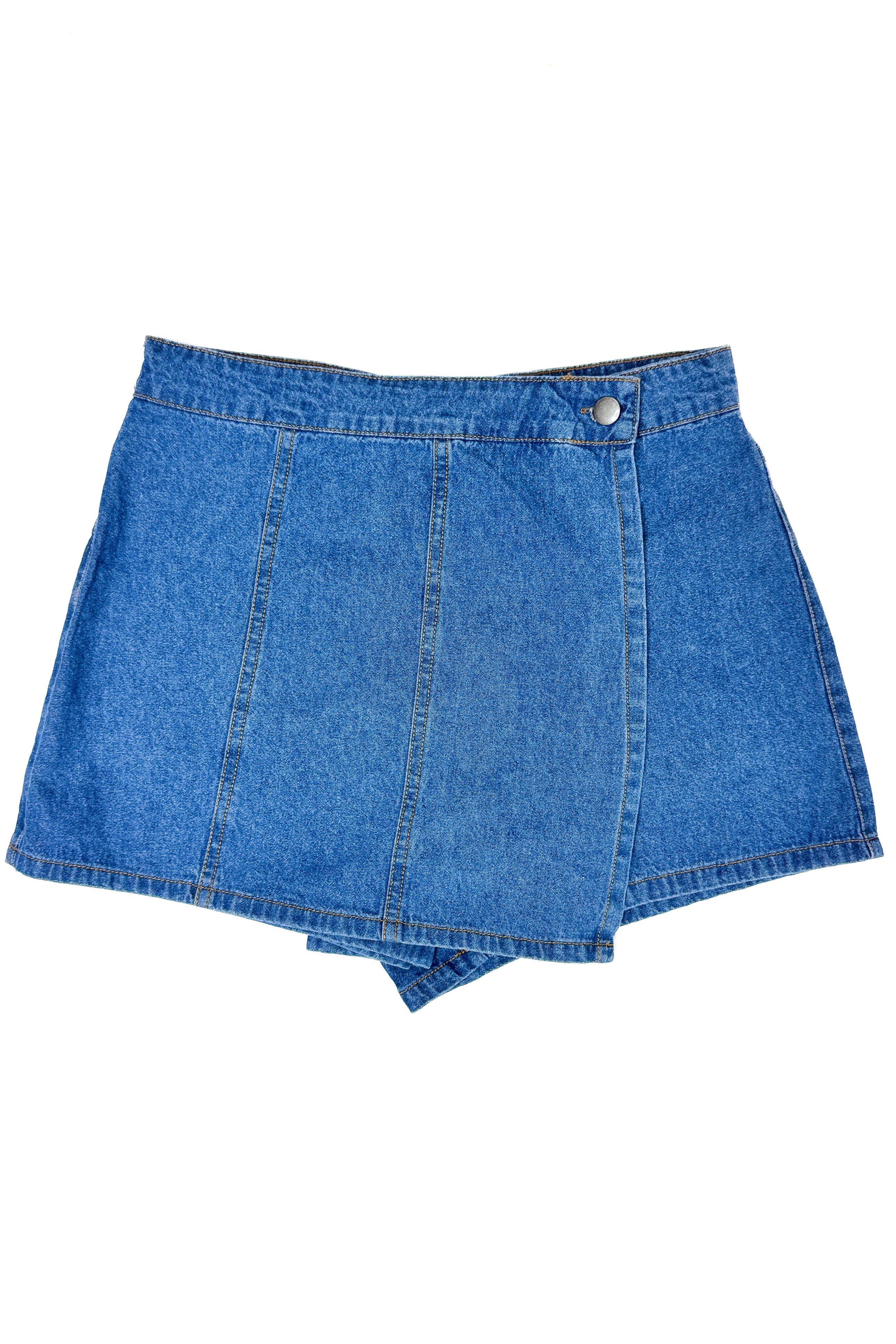 Flat lay of Medium Wash Denim Wrap Skort against white studio background.