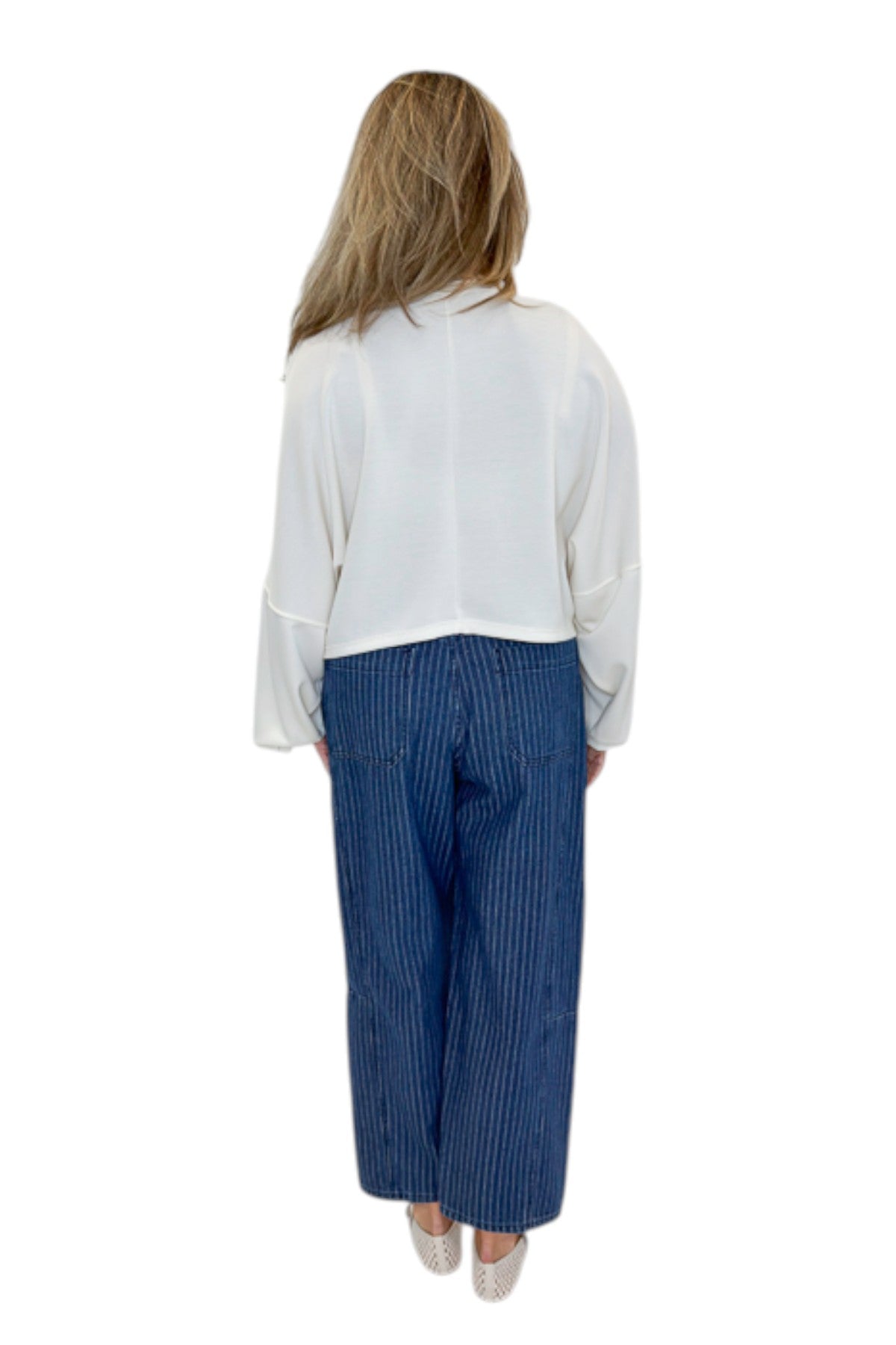 Back view of woman wearing Swagger Boutique’s Dark Wash Pinstriped Barrel Jeans with top against white studio background.