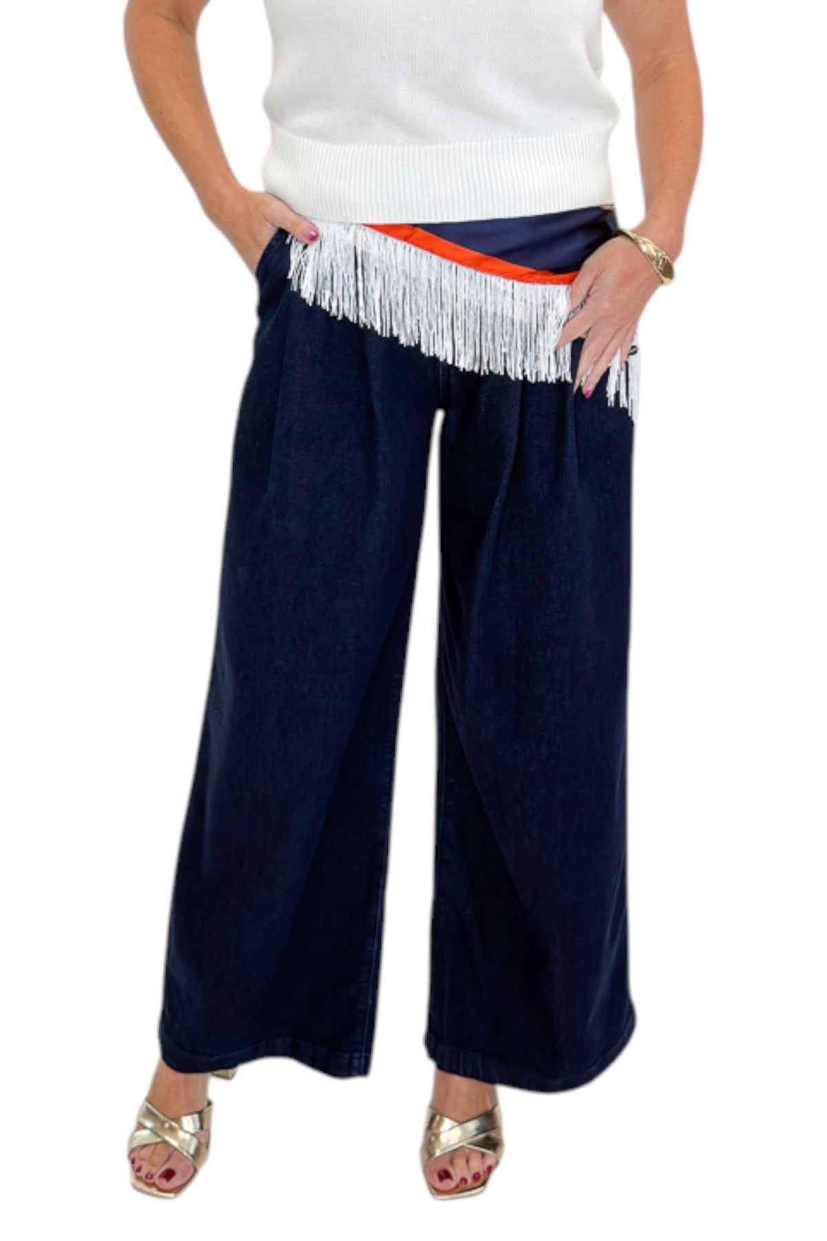Front detail view of woman wearing Swagger Boutiqueās Dark Wash Pleated Trouser Jeans by Risen with sweater & scarf against white studio background.
