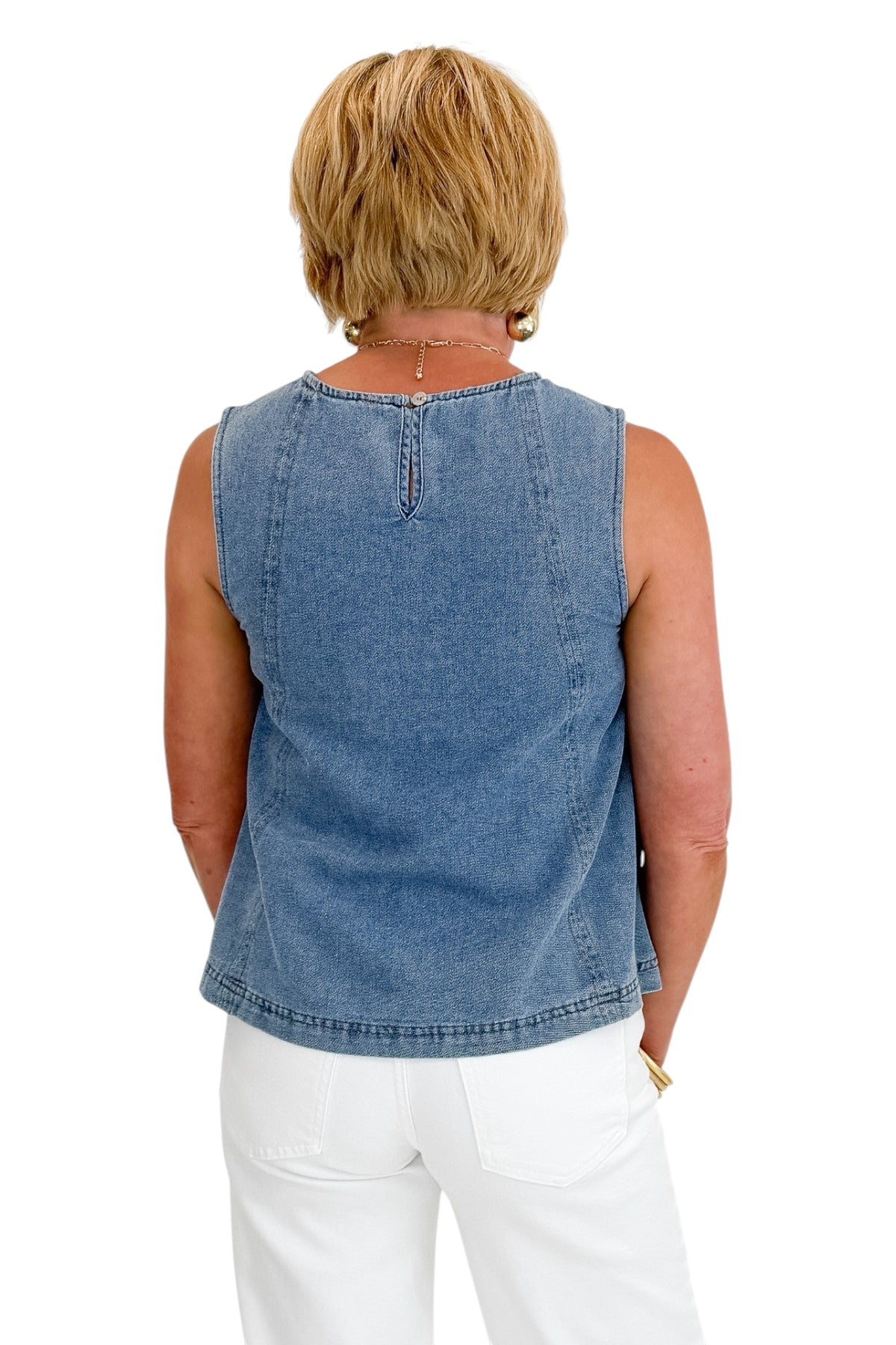 Back view of woman wearing Swagger Boutiqueās Denim Seamed Sleeveless Top with jeans against white studio background.