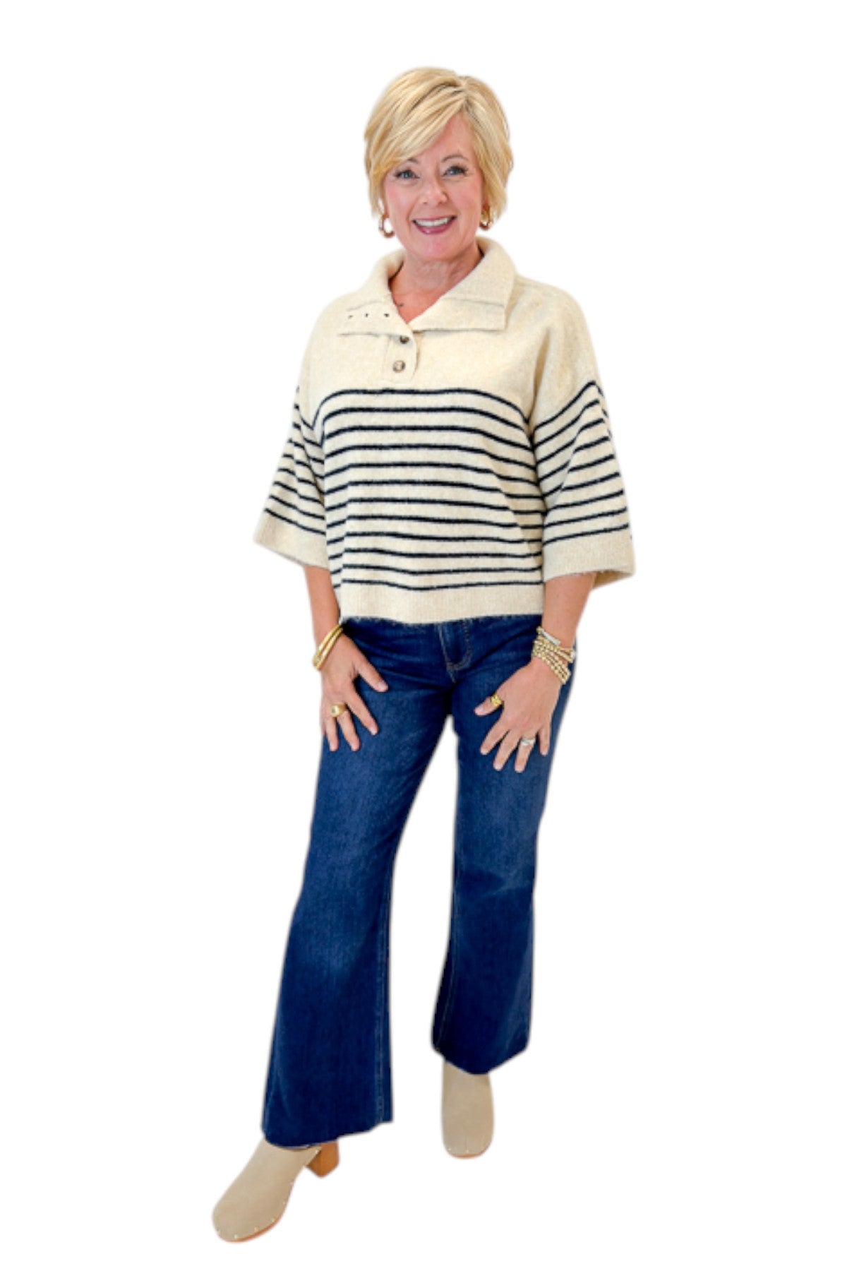 Front view of woman wearing Swagger Boutiqueās Ecru & Navy Striped 3/4 Sleeve Sweater by Entro with jeans against white studio background.