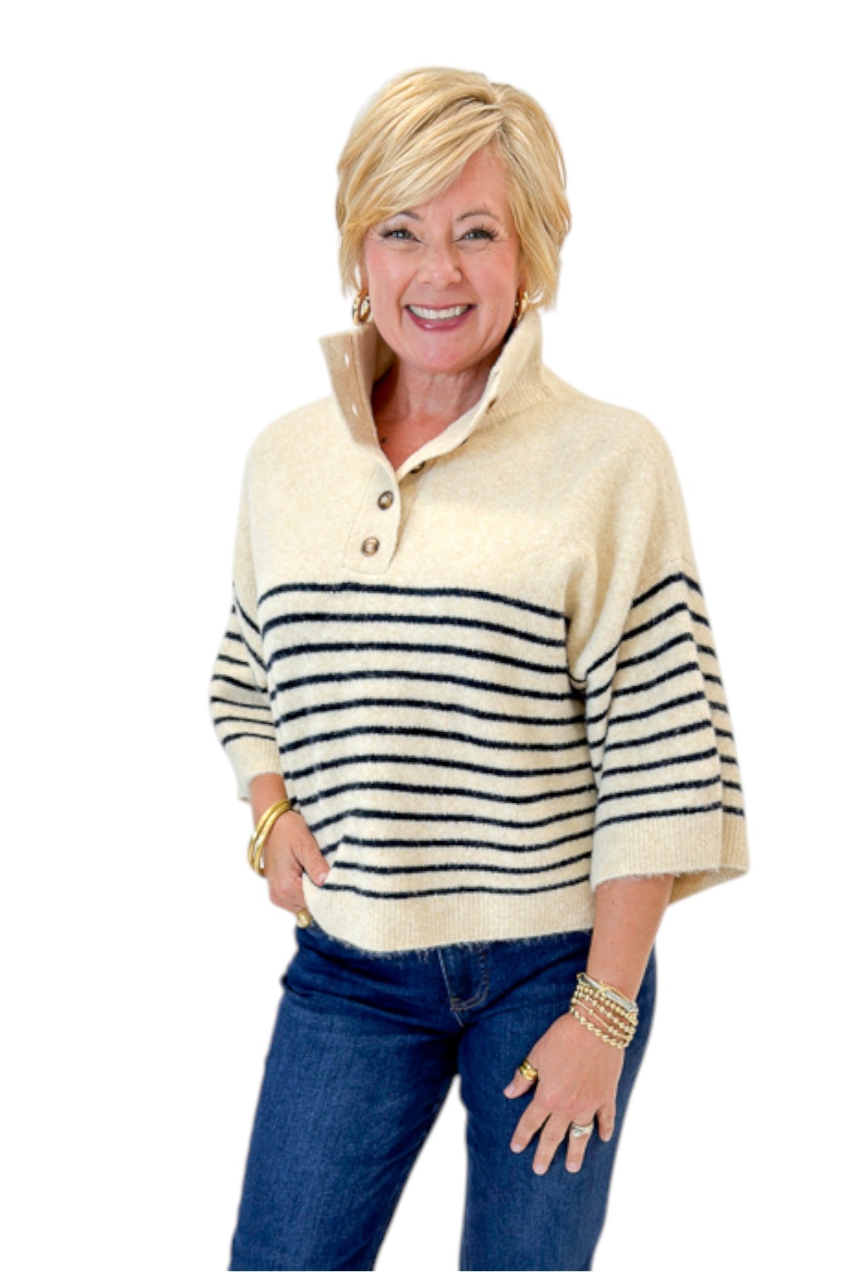 Front view of woman wearing Swagger Boutiqueās Ecru & Navy Striped 3/4 Sleeve Sweater by Entro with jeans against white studio background.