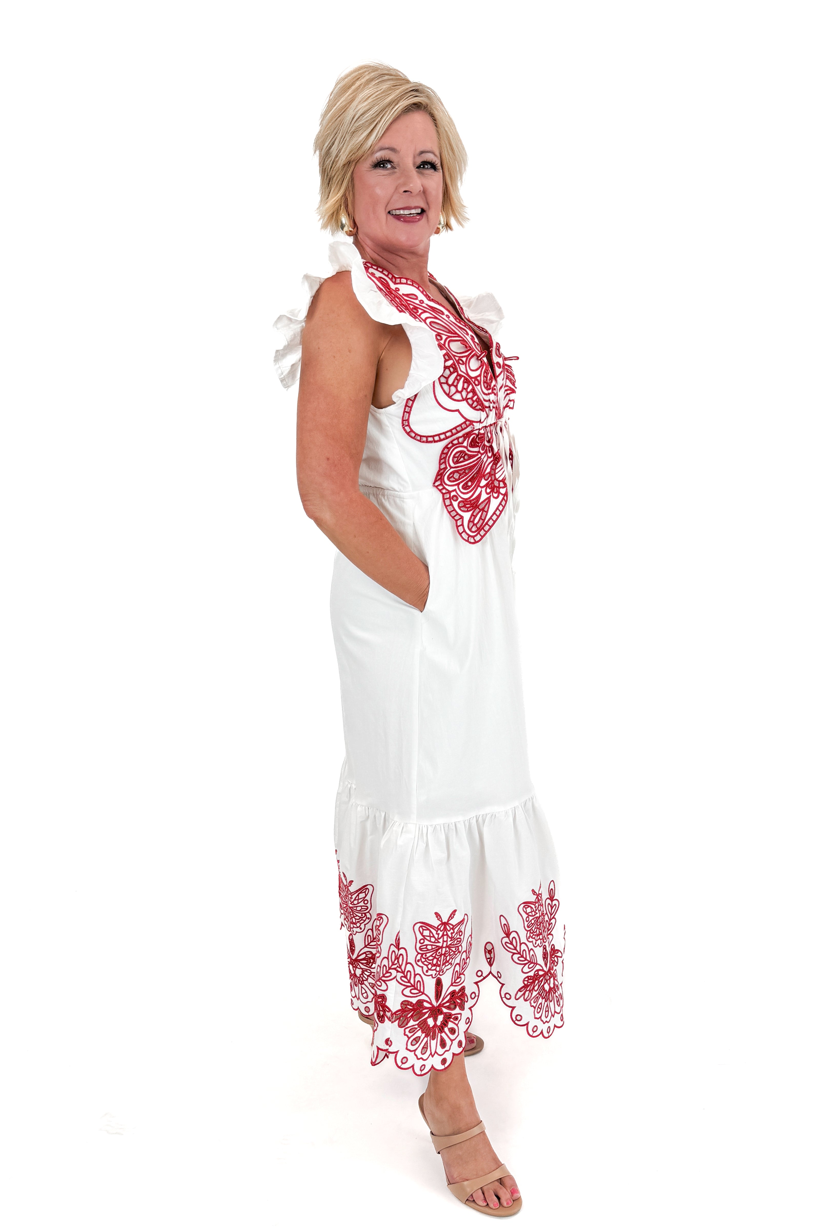 Side view of woman wearing Red & White Butterfly Embroidered Midi Dress by Fate against white studio background.