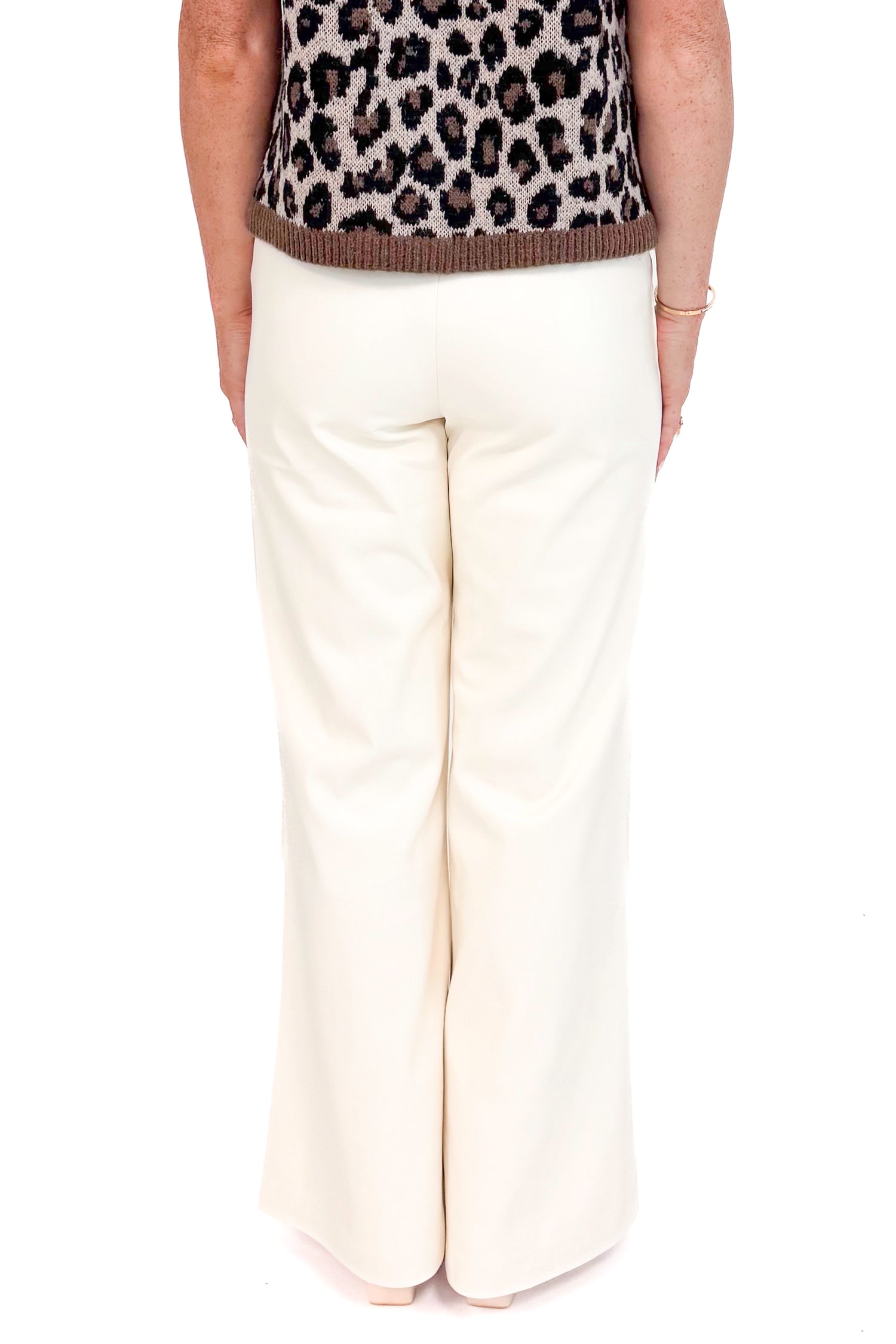 Back view of picture of woman wearing White Faux Leather Seam Detail Pants by Elan with white background.