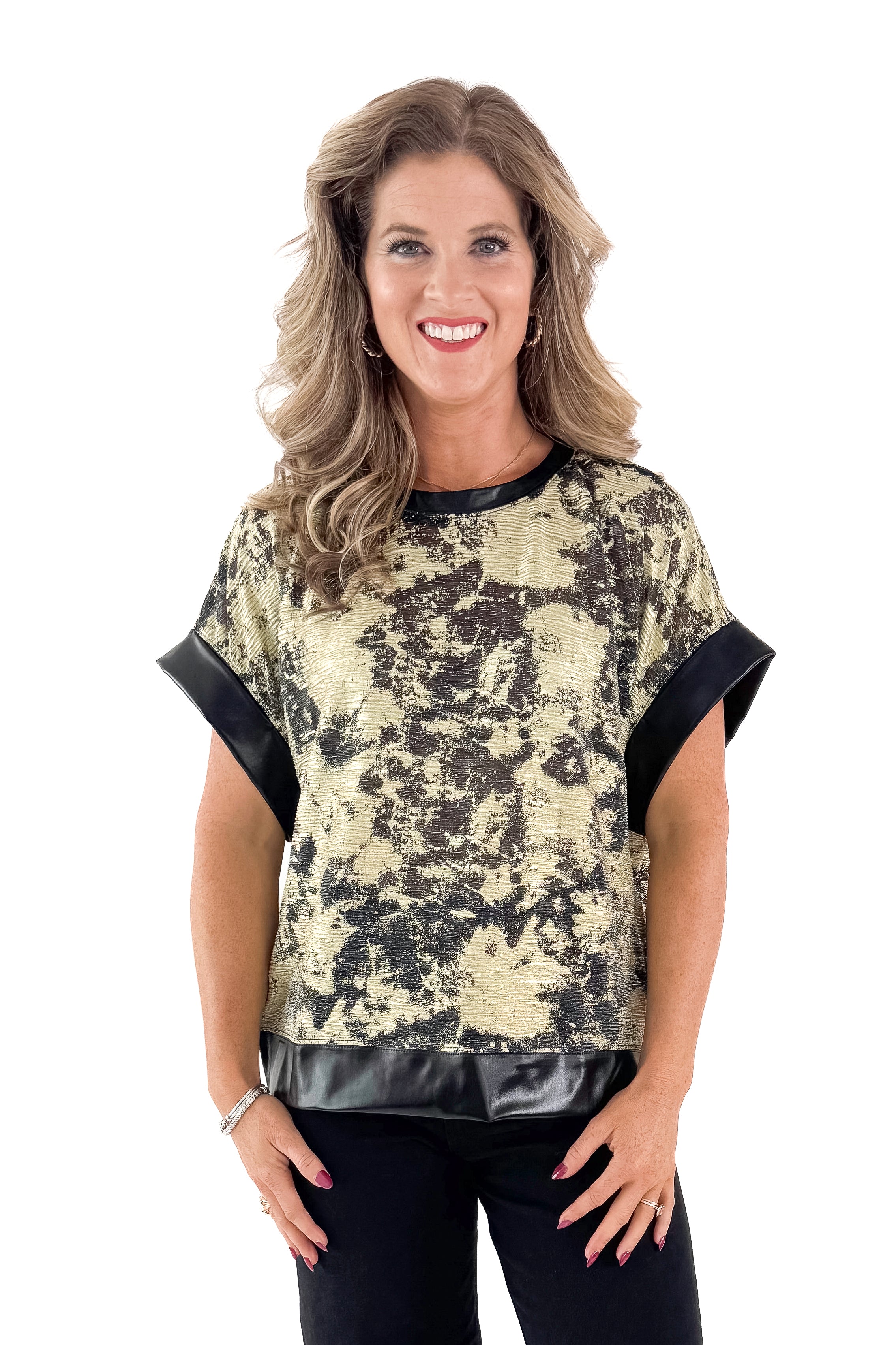 Front view of woman wearing Black & Gold Metallic Abstract Print Top with jeans against white studio background.