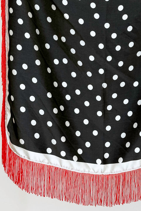 Fringe Detail Black With Polka Dots Square Scarf hanging on a rack detailed.